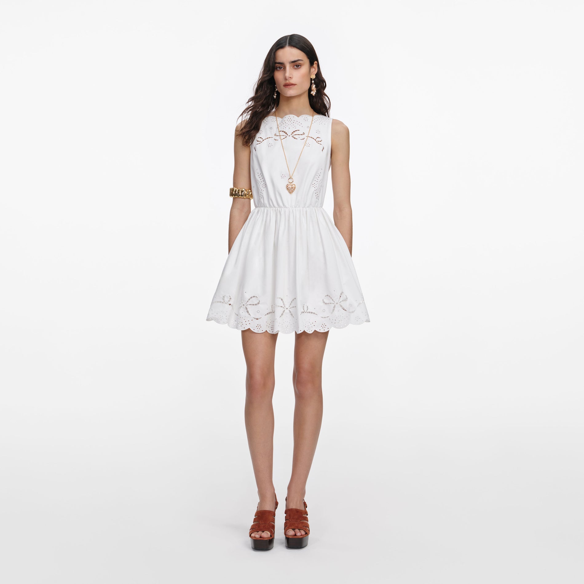 Front view of a woman wearing the White Cotton Embroidered Mini Dress
