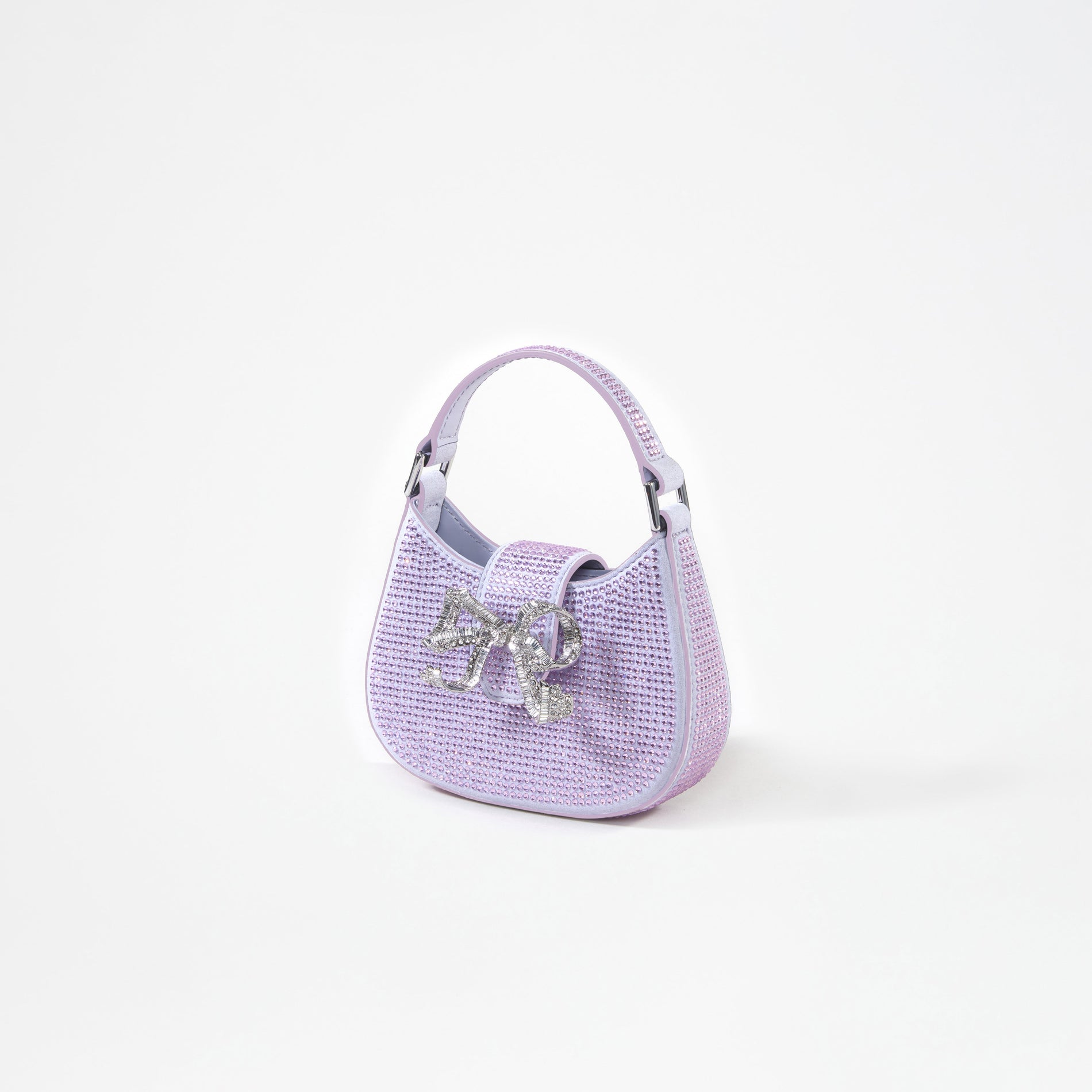 A woman wearing the Purple Rhinestone Crescent Bow Micro Bag