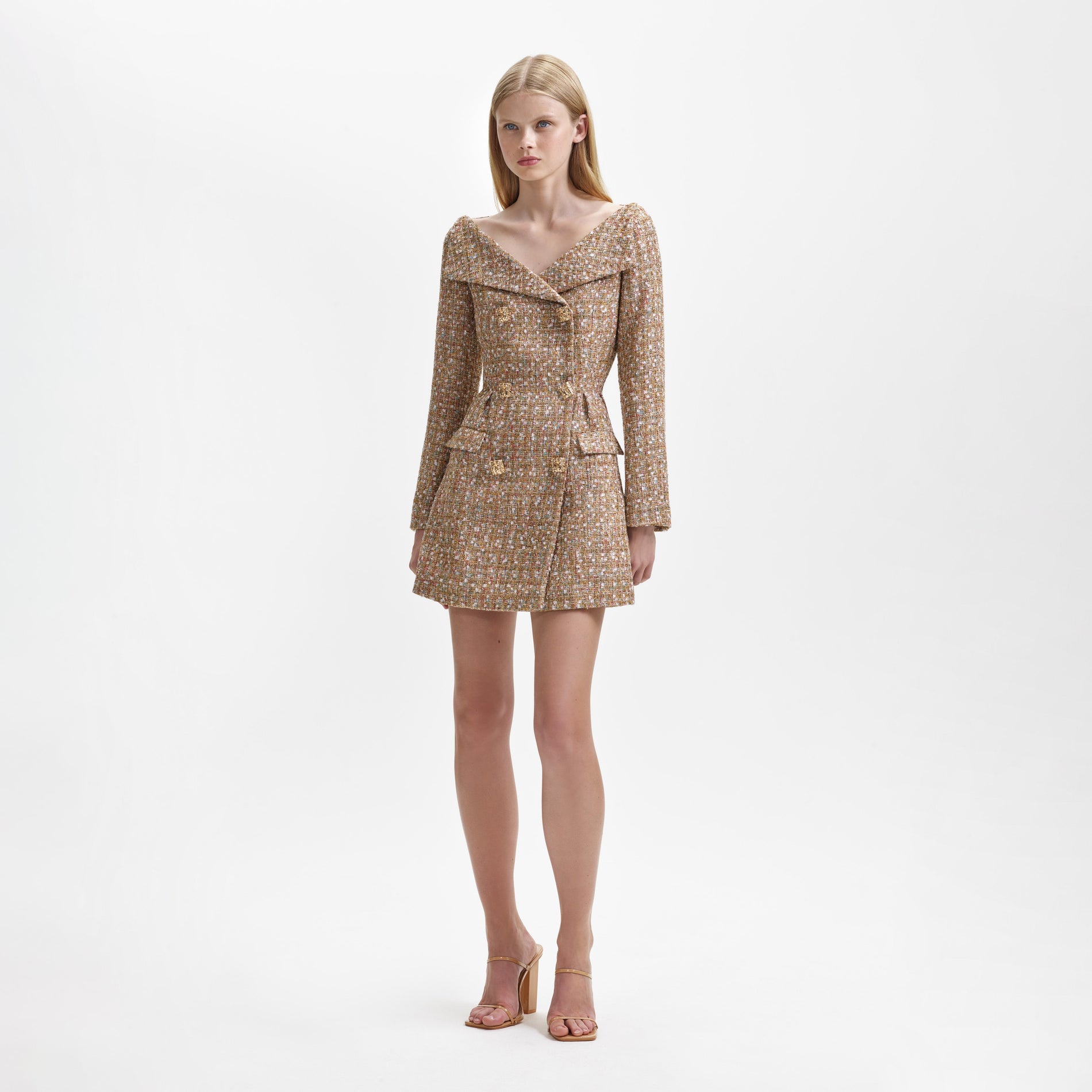 Side view of a woman wearing the Gold Tinsel Boucle Off Shoulder Mini Dress