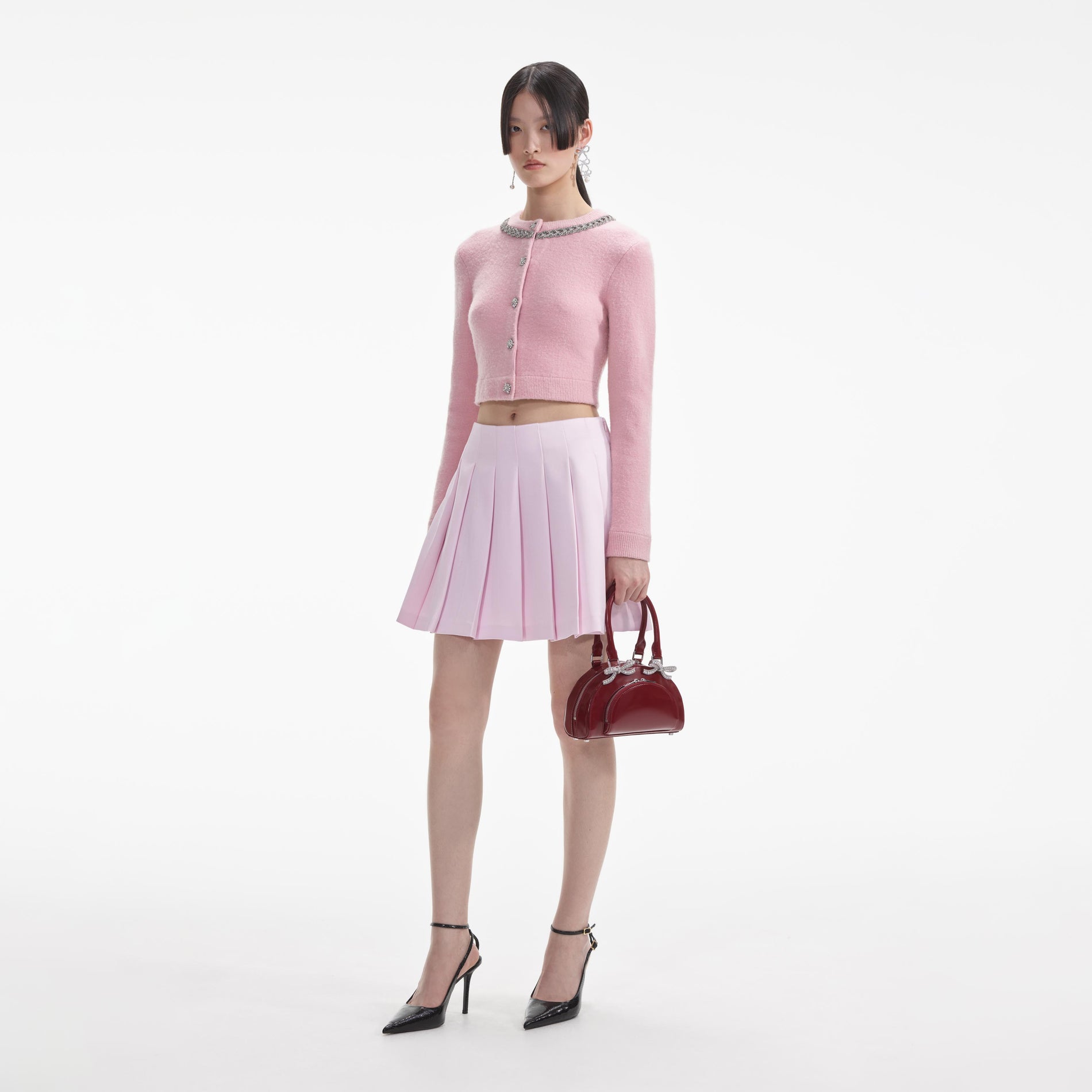 Side view of a woman wearing the Pink Embellished Cardigan