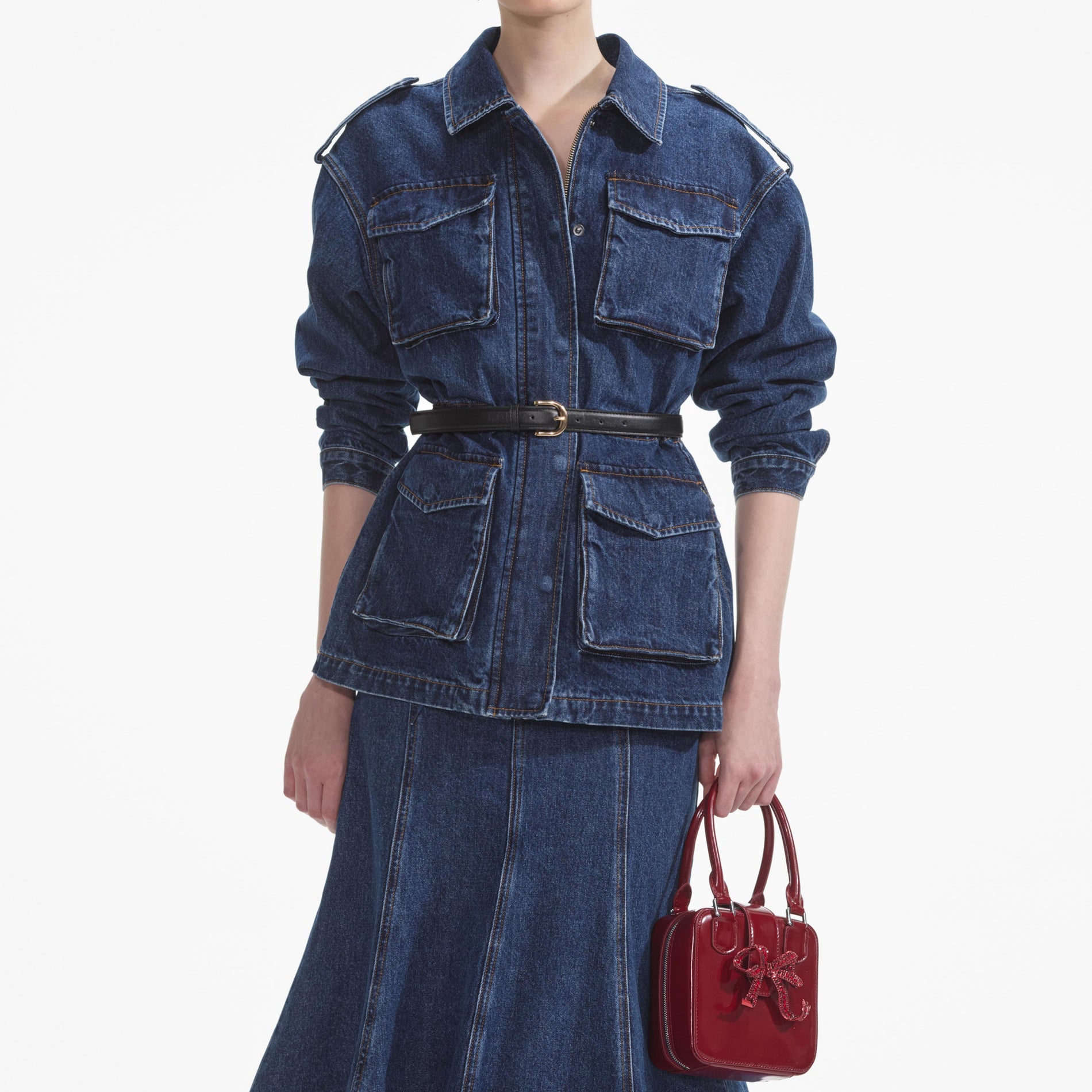 A close up of a woman wearing the Denim Utility Jacket