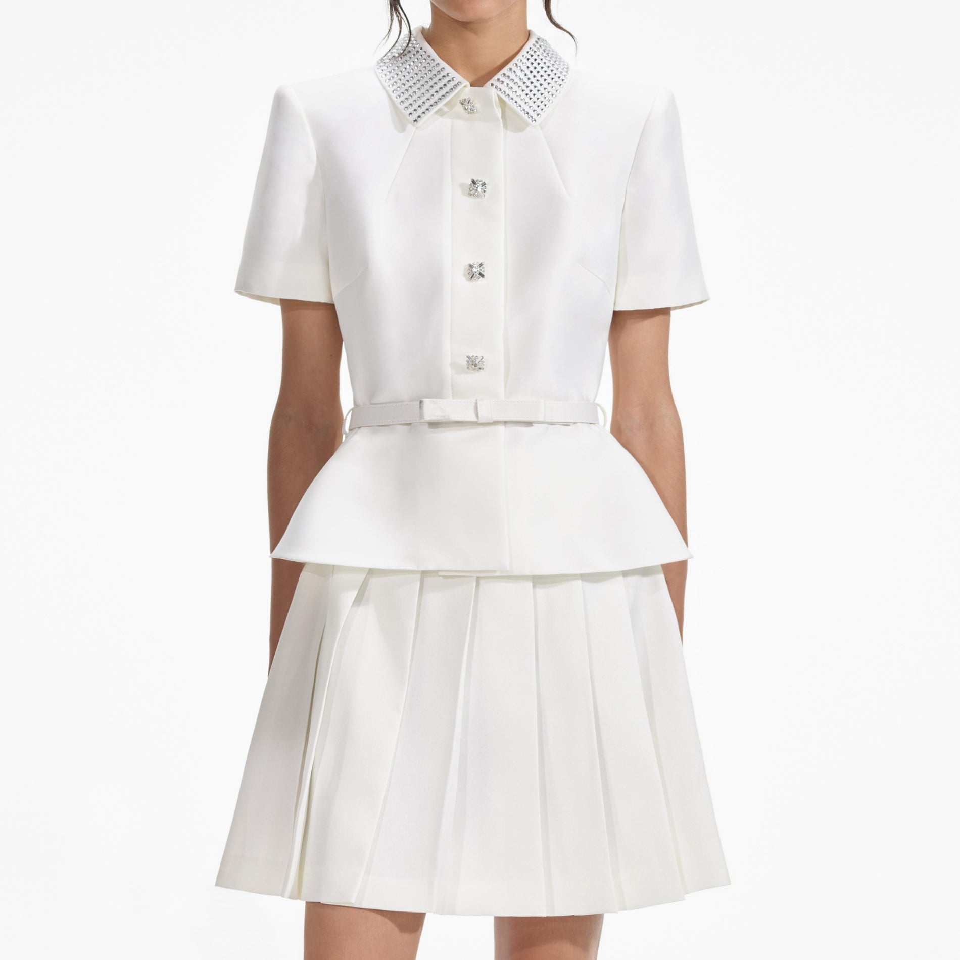 A close up of a woman wearing the Cream Taffeta Diamante Mini Dress