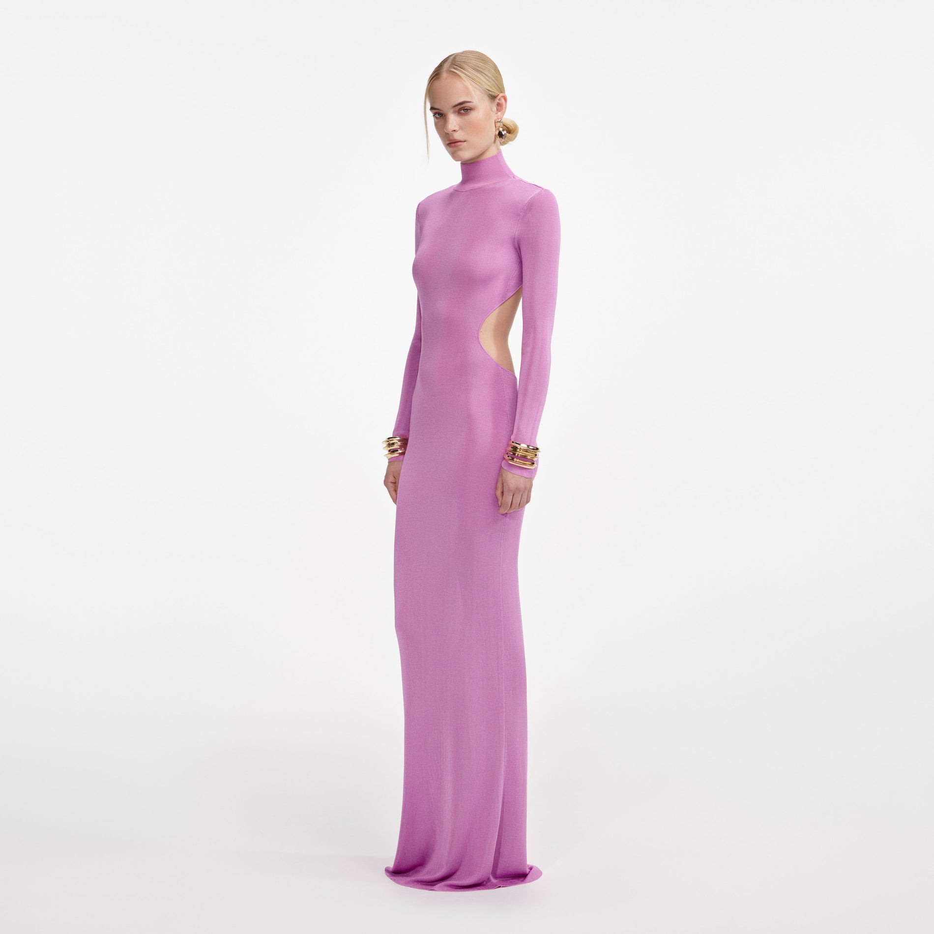 Side view of a woman wearing the Pink Viscose Knit Maxi Dress