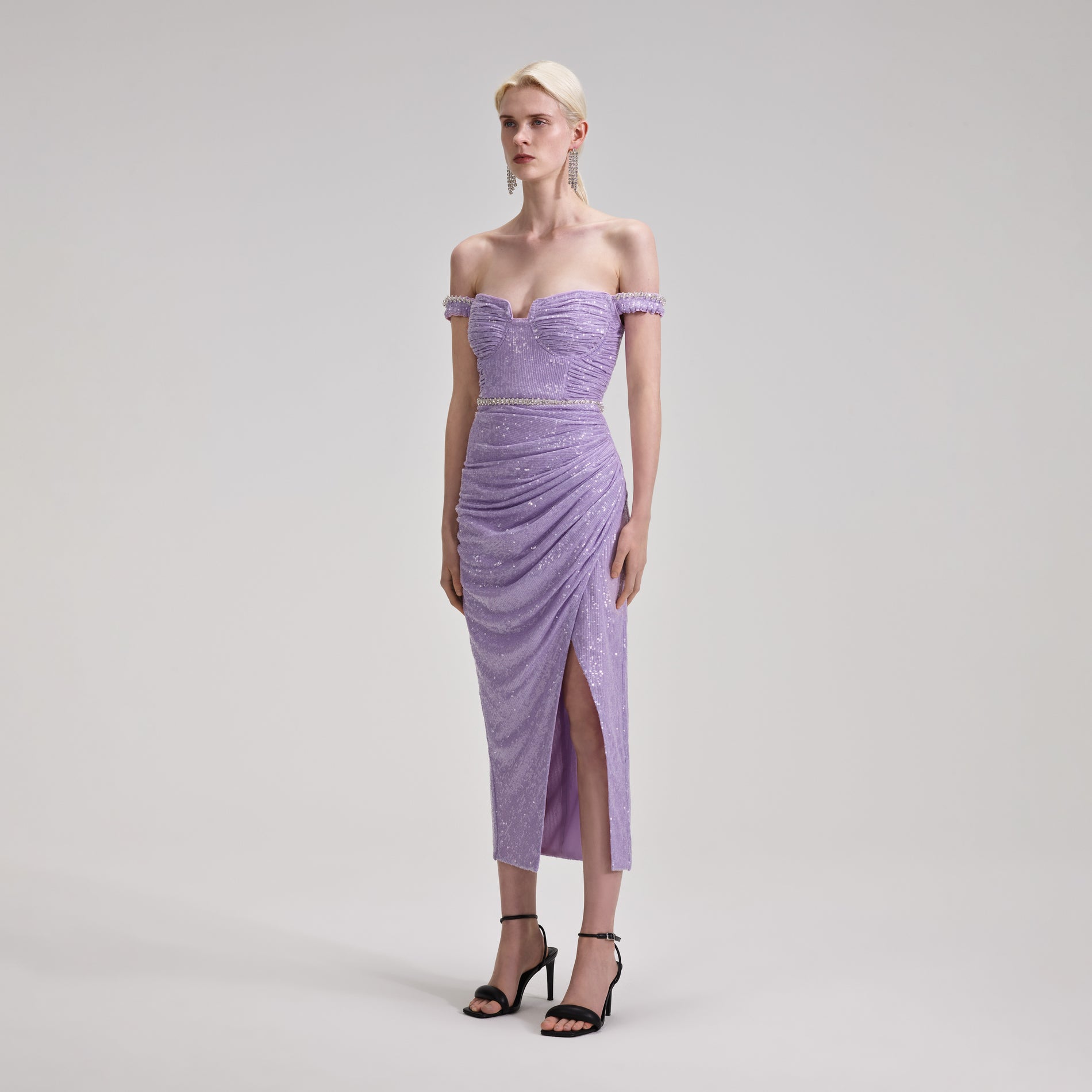 A woman wearing the Lilac Sequin Midi Dress