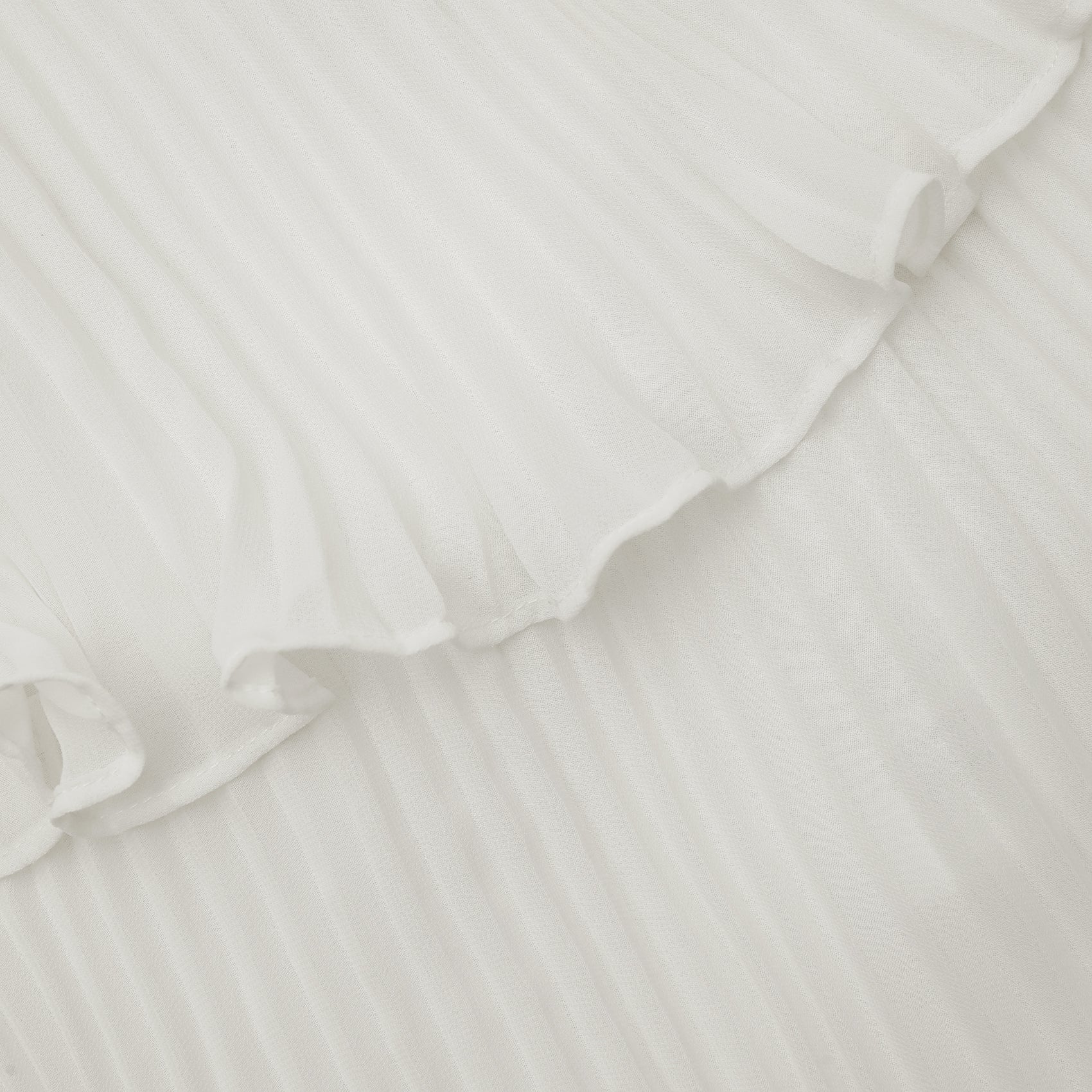 A close up of the fabric for the Cream Chiffon Tiered Dress