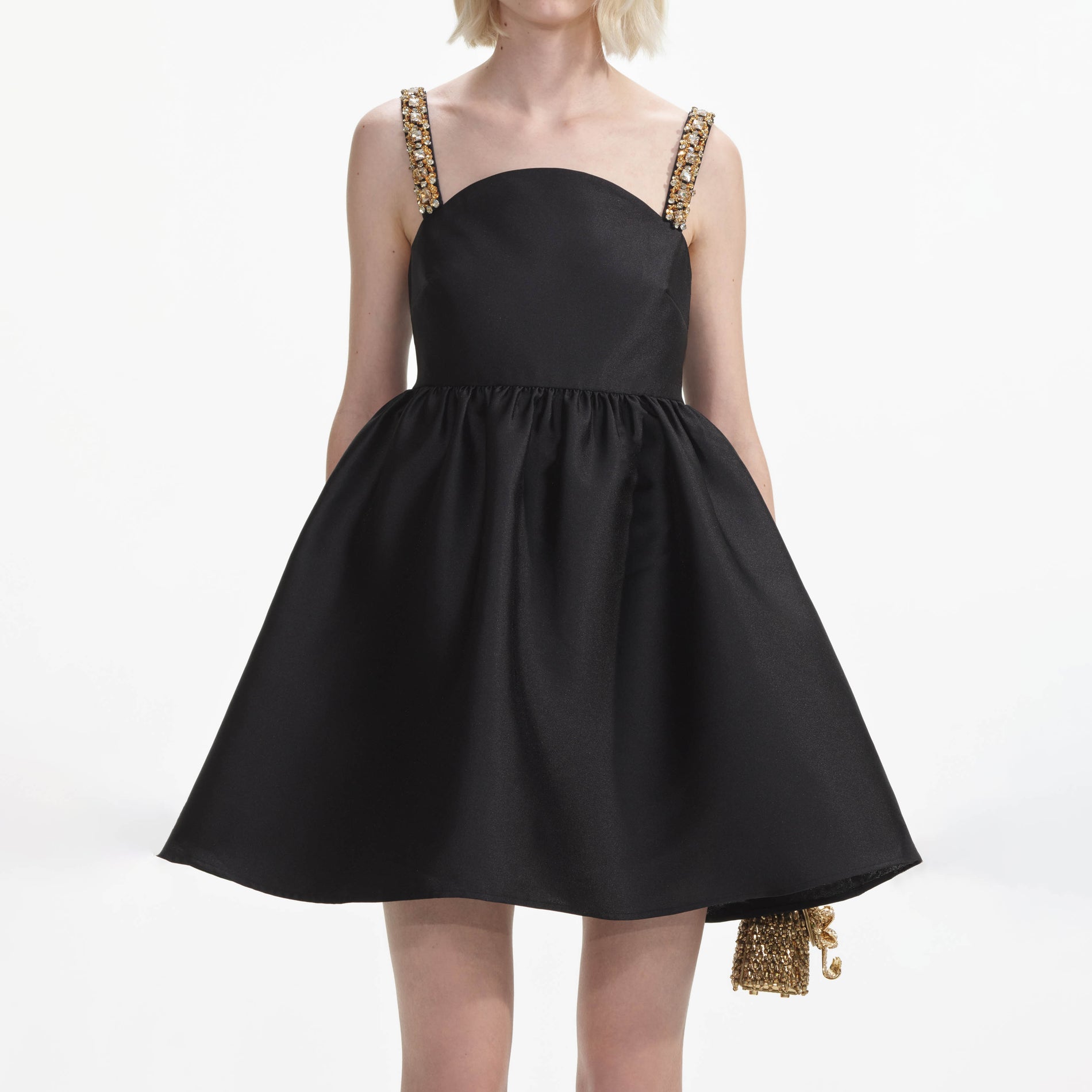 A close up of a woman wearing the Black Taffeta Embellished Mini Dress