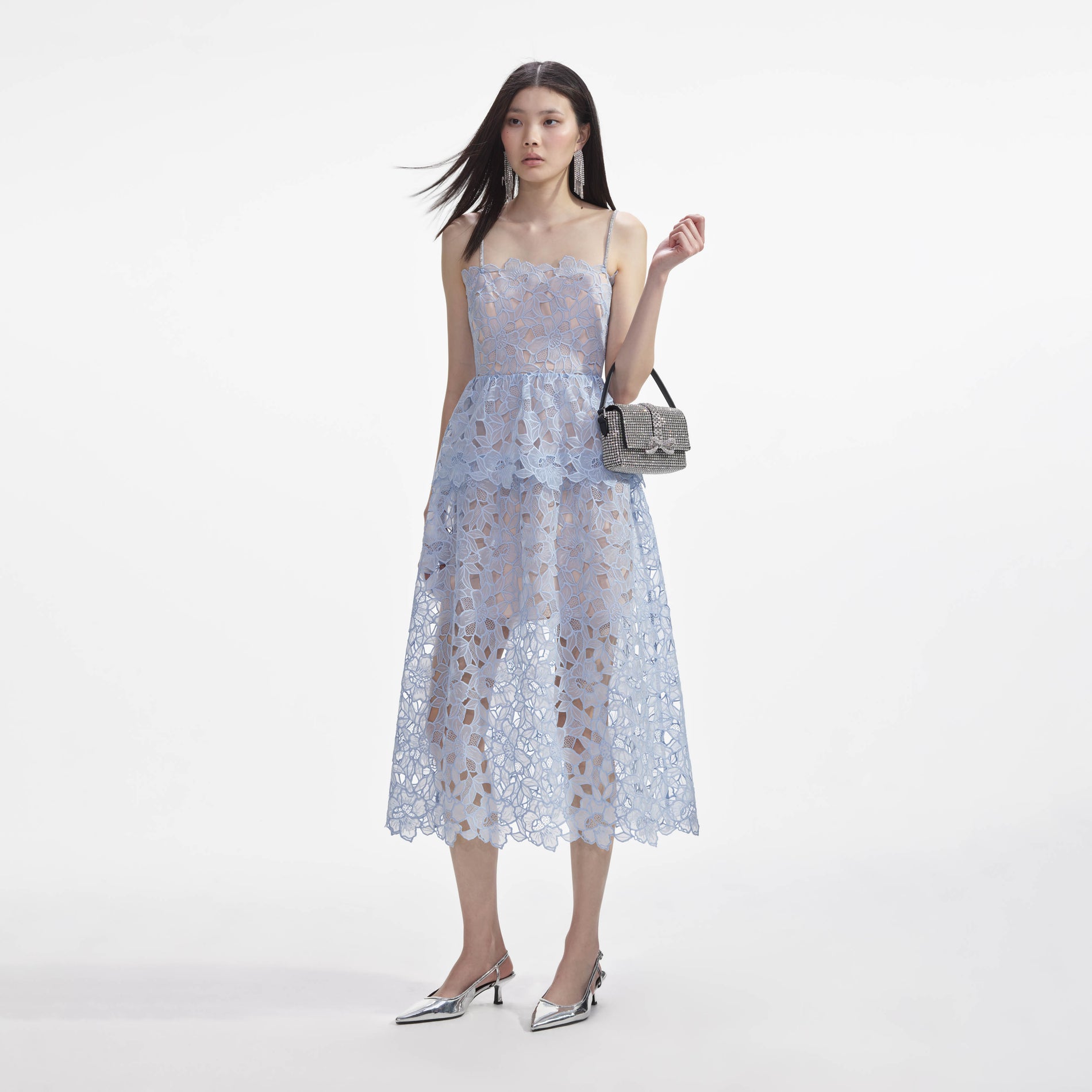 Side view of a woman wearing the Blue Organza Lace Midi Dress
