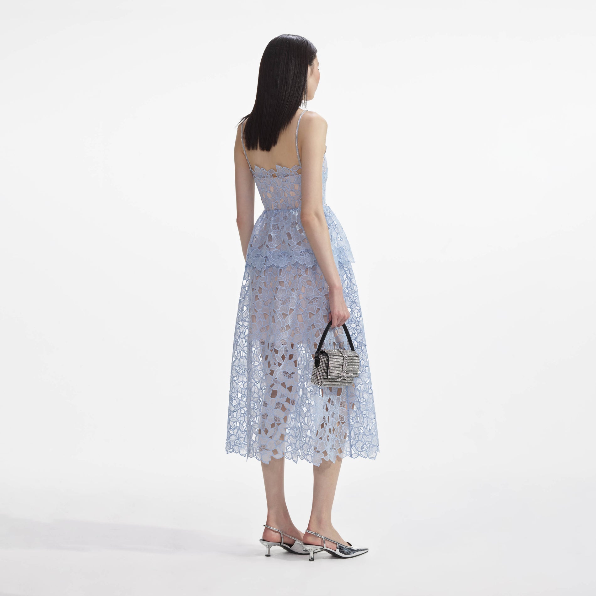 Back view of a woman wearing the Blue Organza Lace Midi Dress