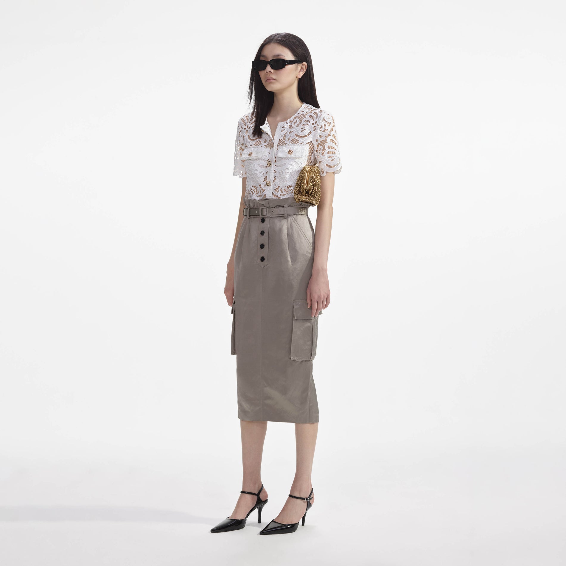 Side view of a woman wearing the Satin Cargo Midi Skirt