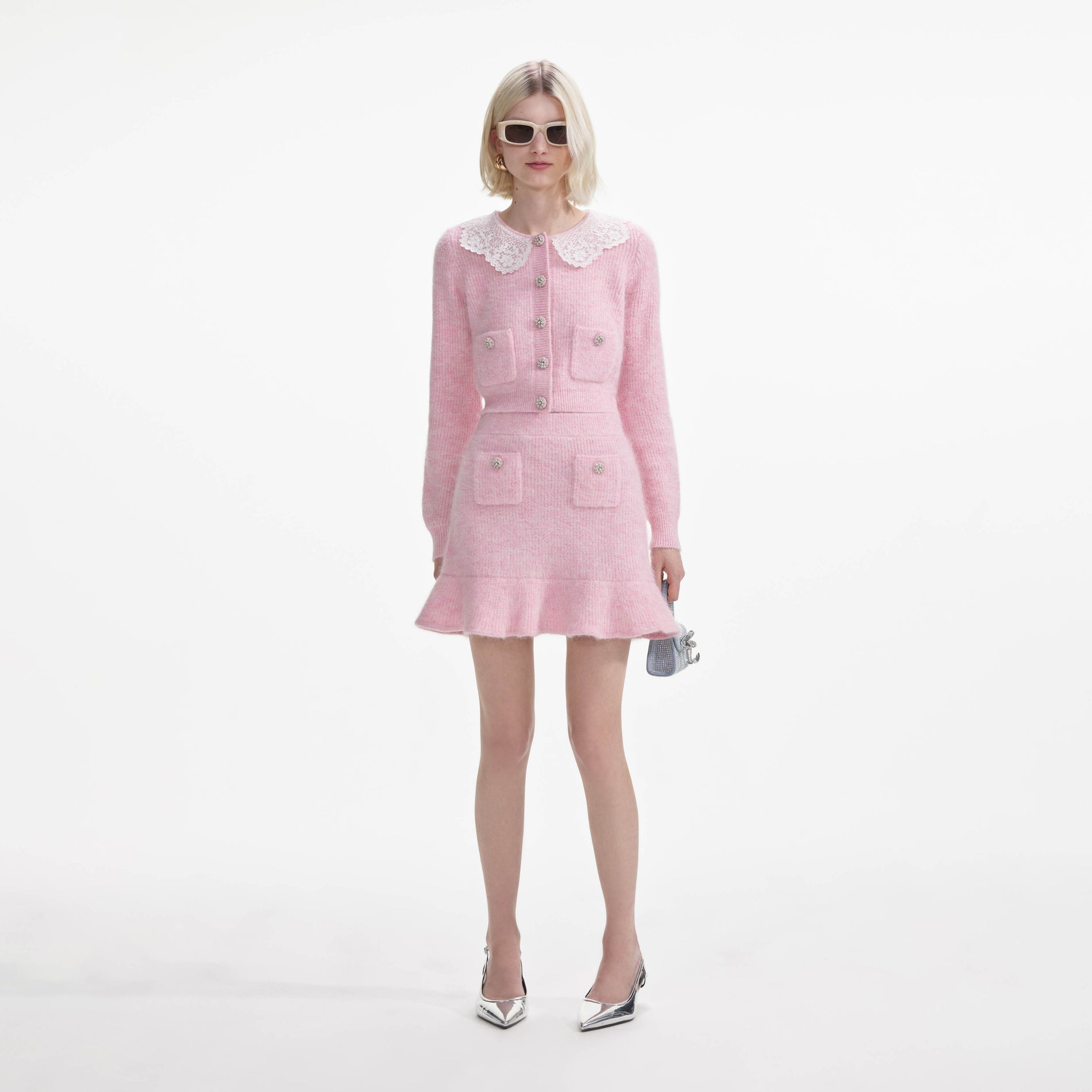 Front view of a woman wearing the Pink Fluffy Rib Knit Mini Skirt