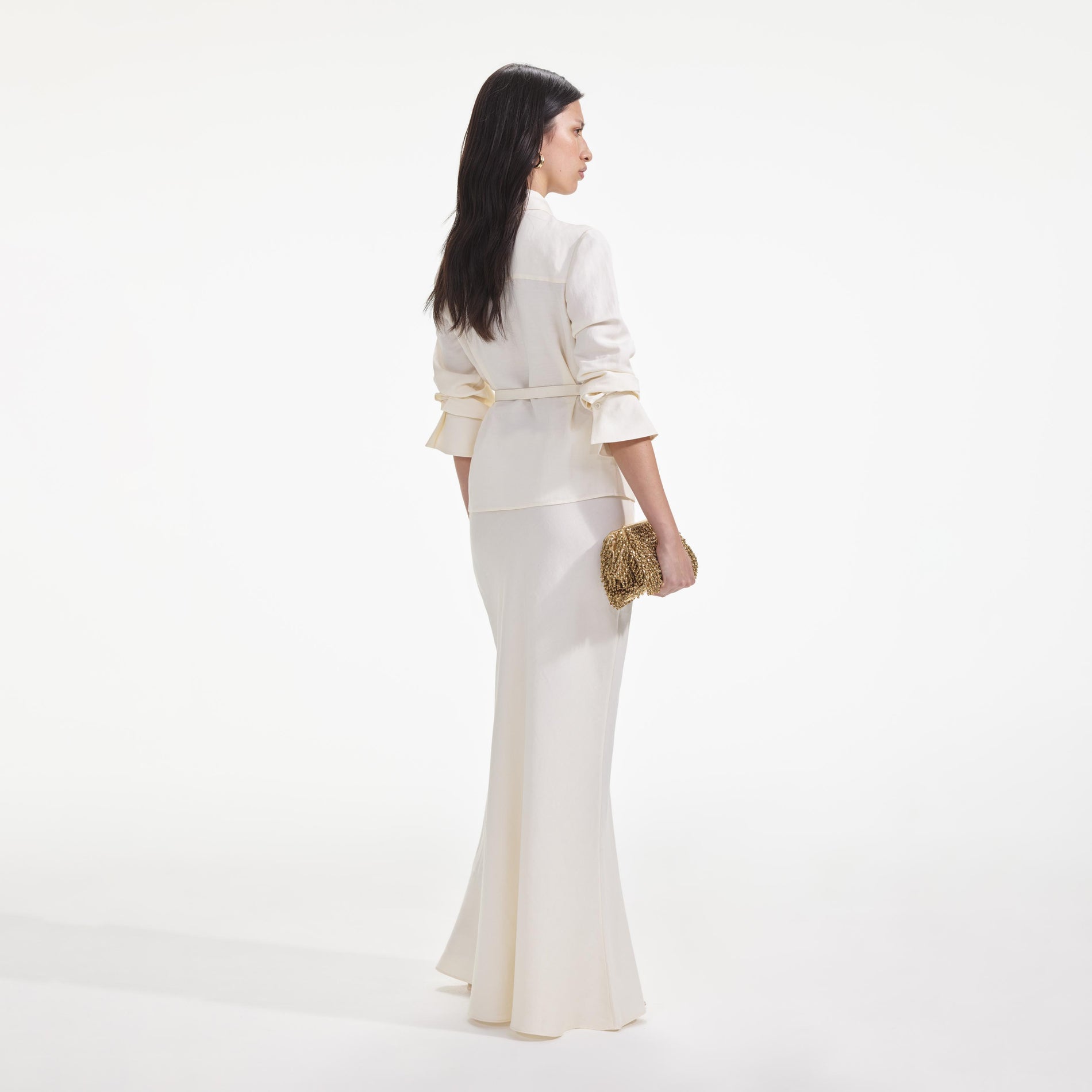 Back view of a woman wearing the Cream Linen Maxi Dress