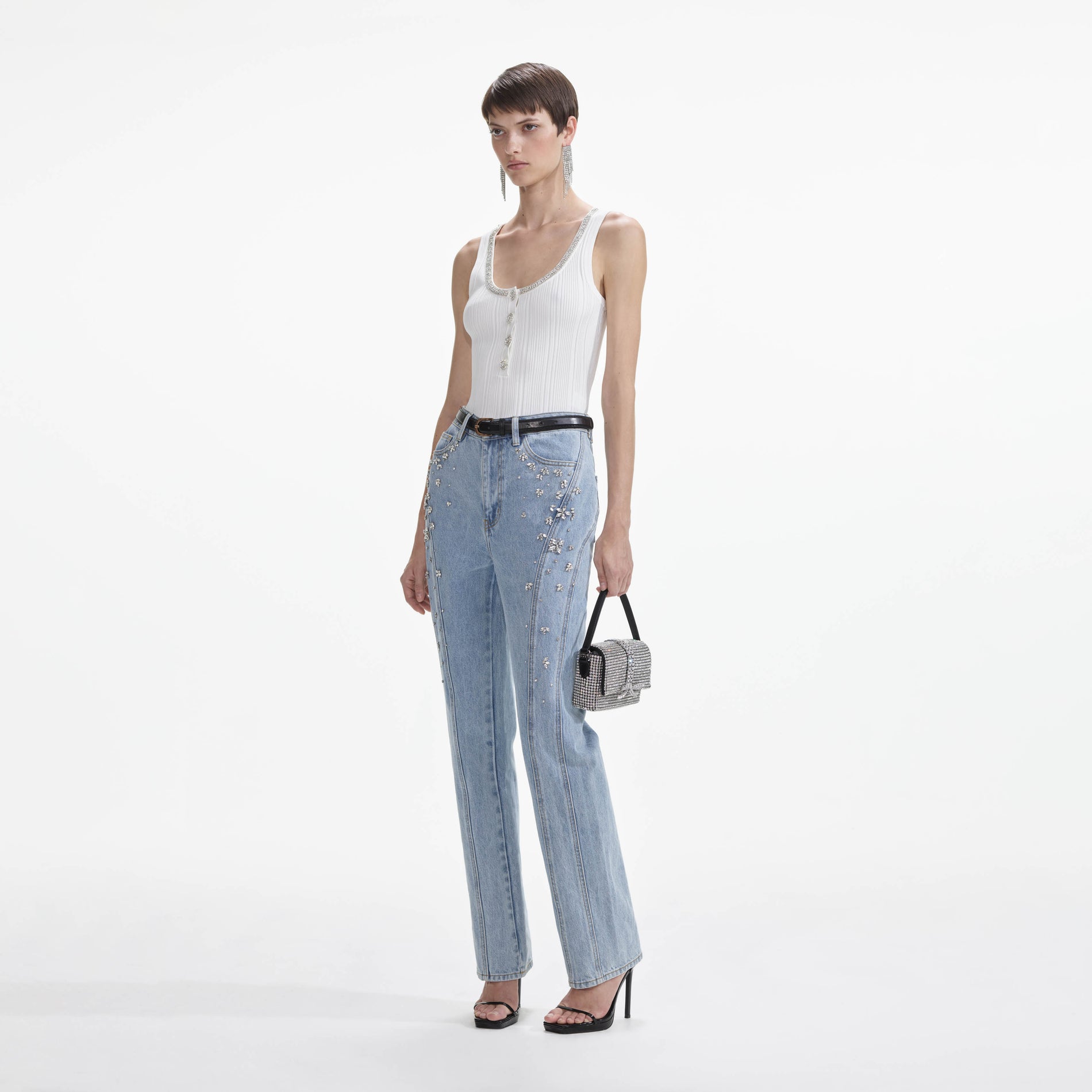 Side view of a woman wearing the Crystal Embellished Denim Jeans