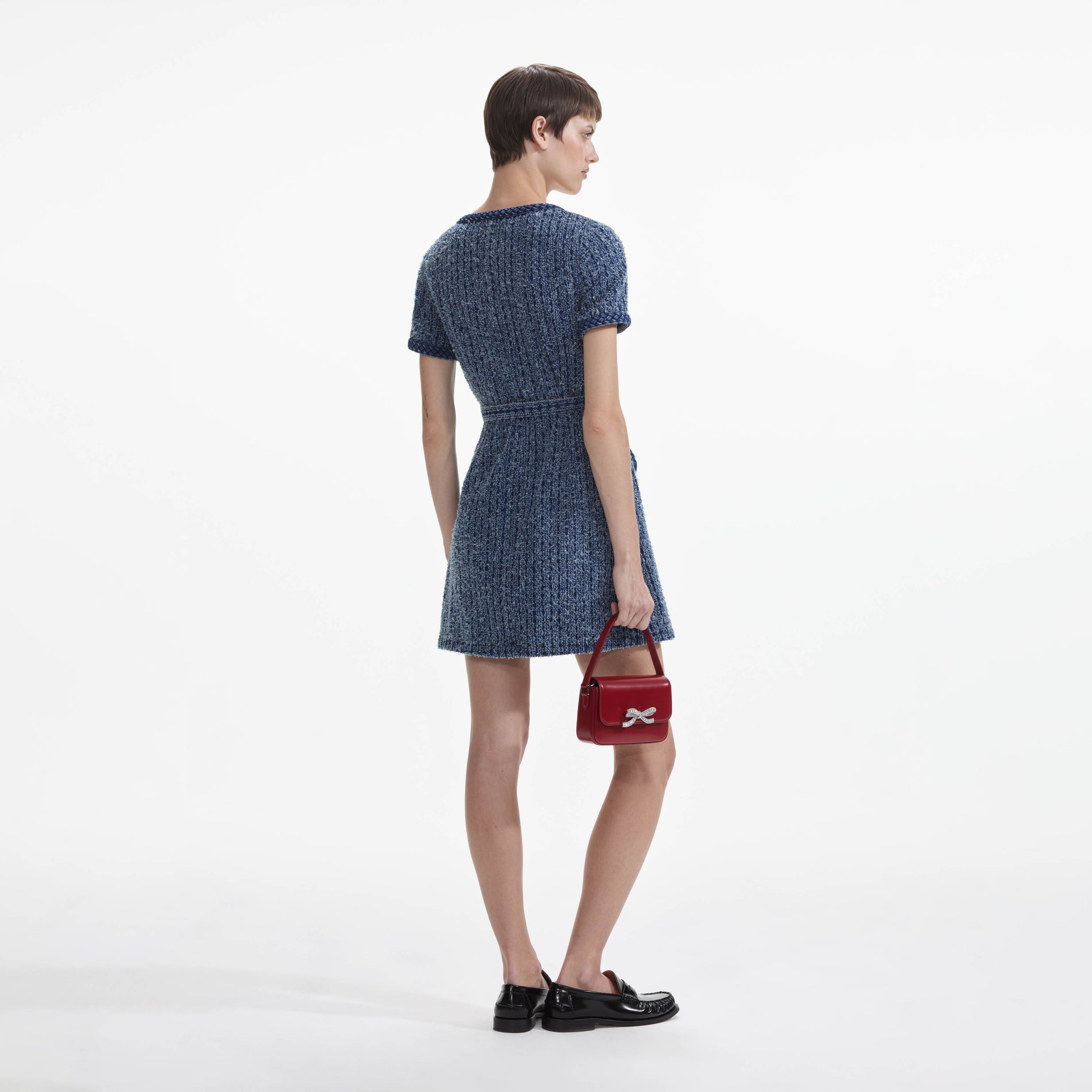 Back view of a woman wearing the Textured Denim Short Sleeve Mini Dress