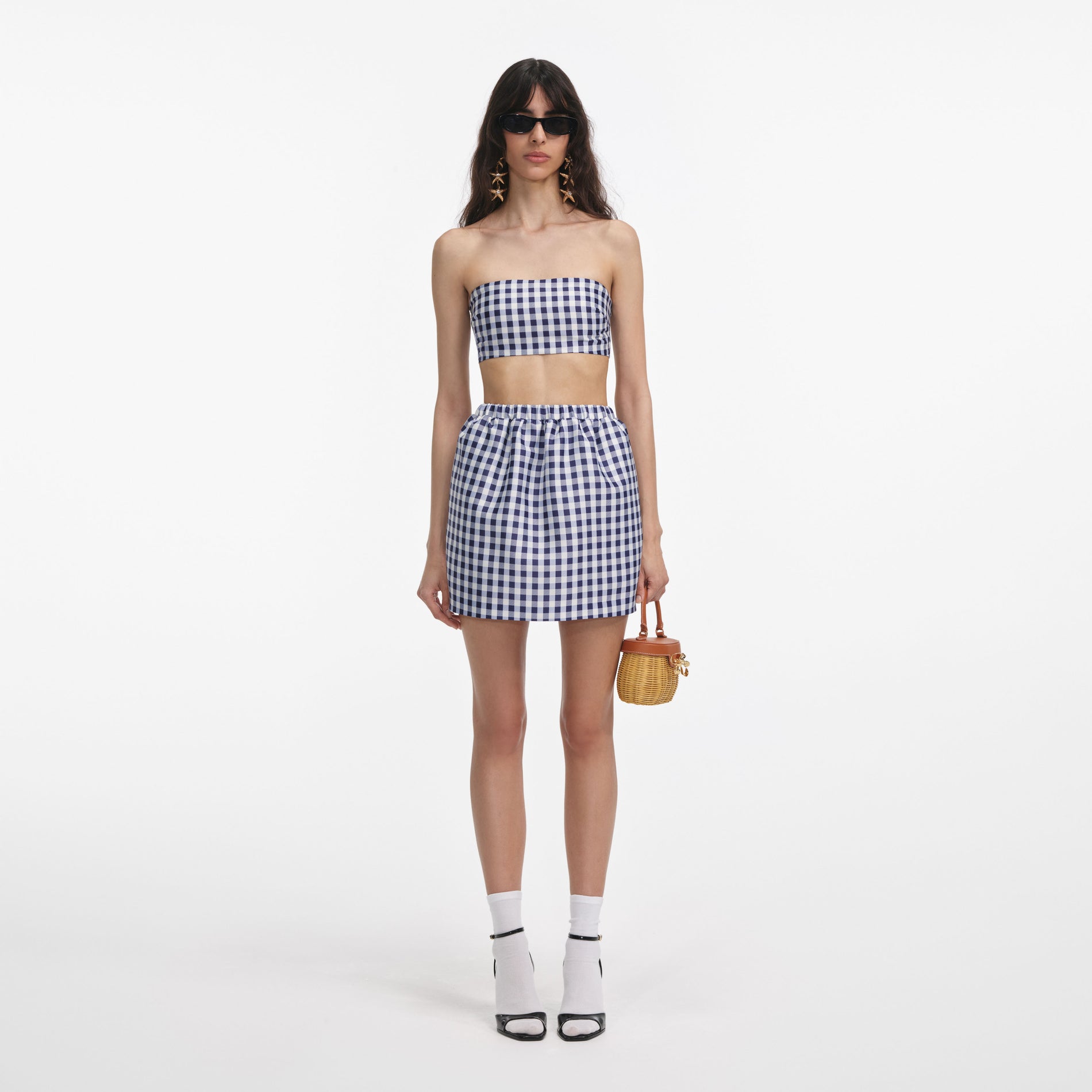 Front view of a woman wearing the Navy Gingham Taffeta Mini Skirt