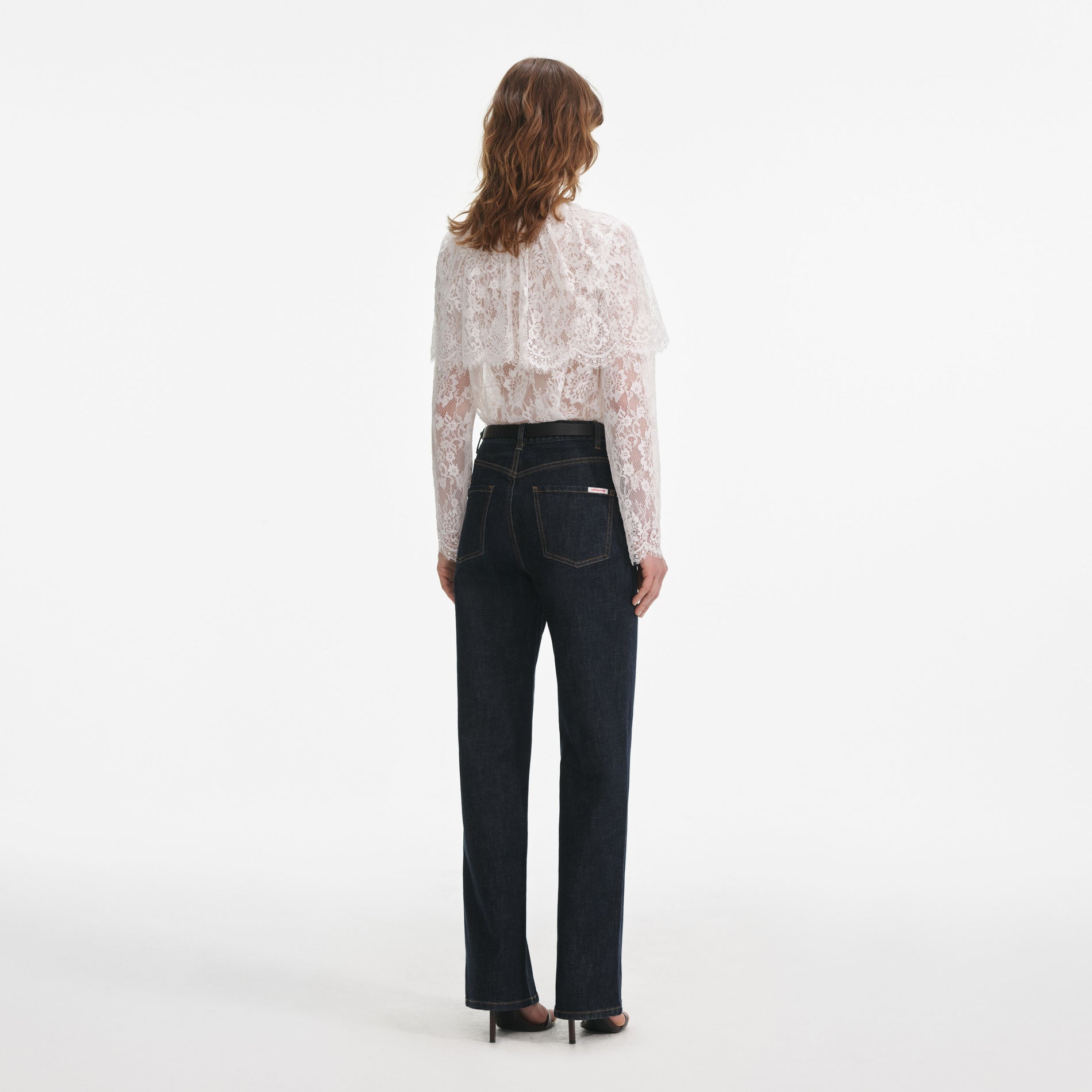 Back view of a woman wearing the White Lace Cape Top
