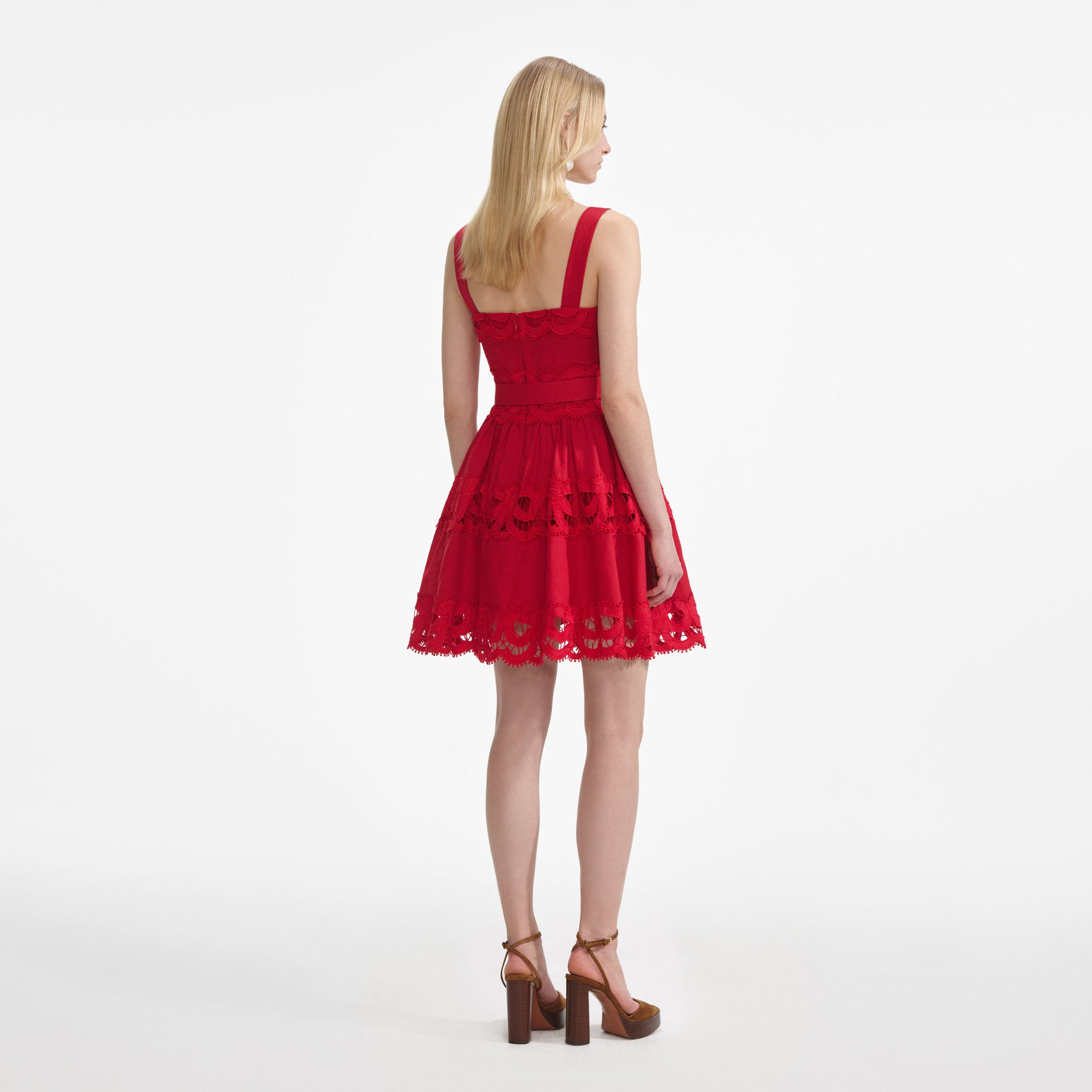 Back view of a woman wearing the Red Linen Lace Insert Mini Dress