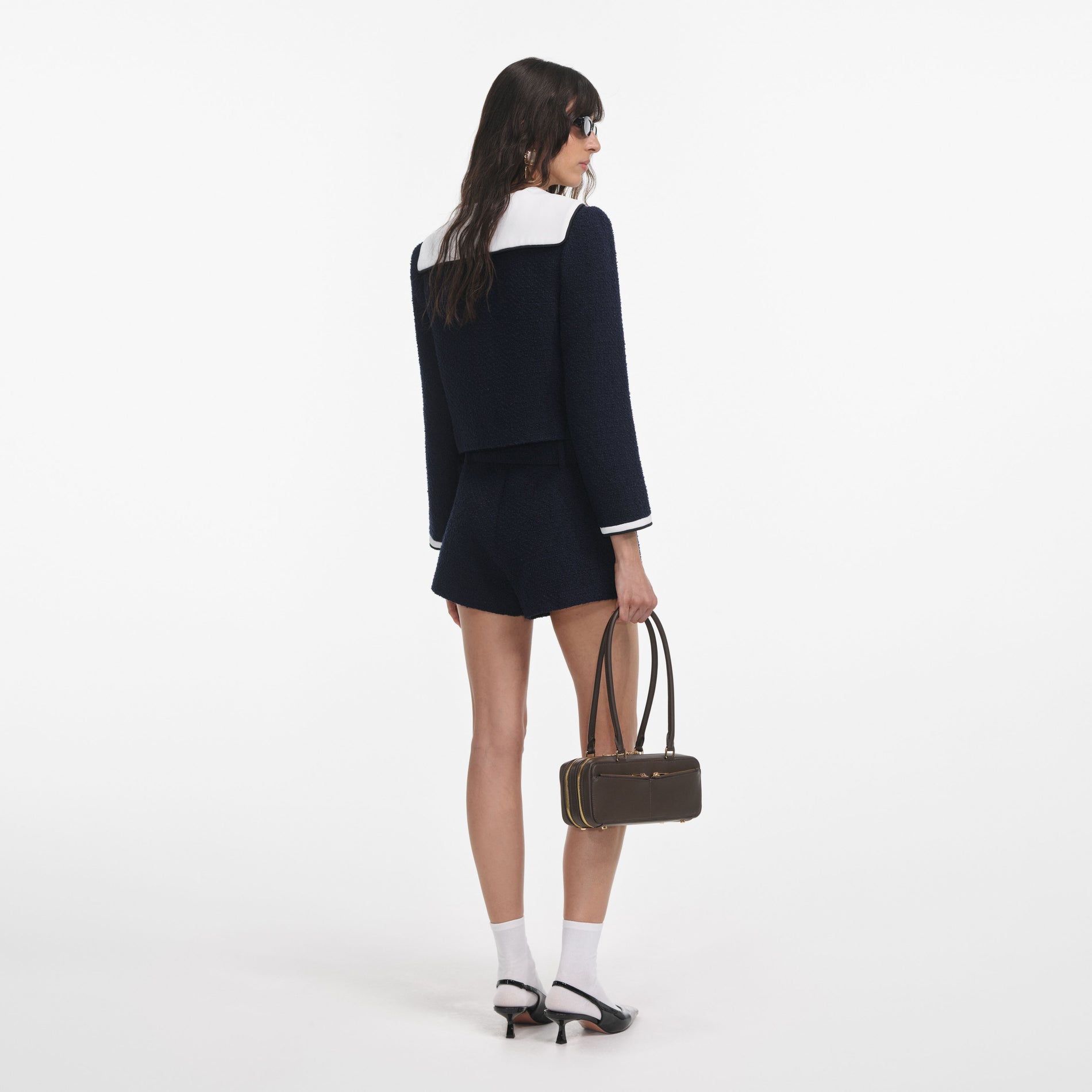 Back view of a woman wearing the Navy Boucle Contrast Collar Jacket