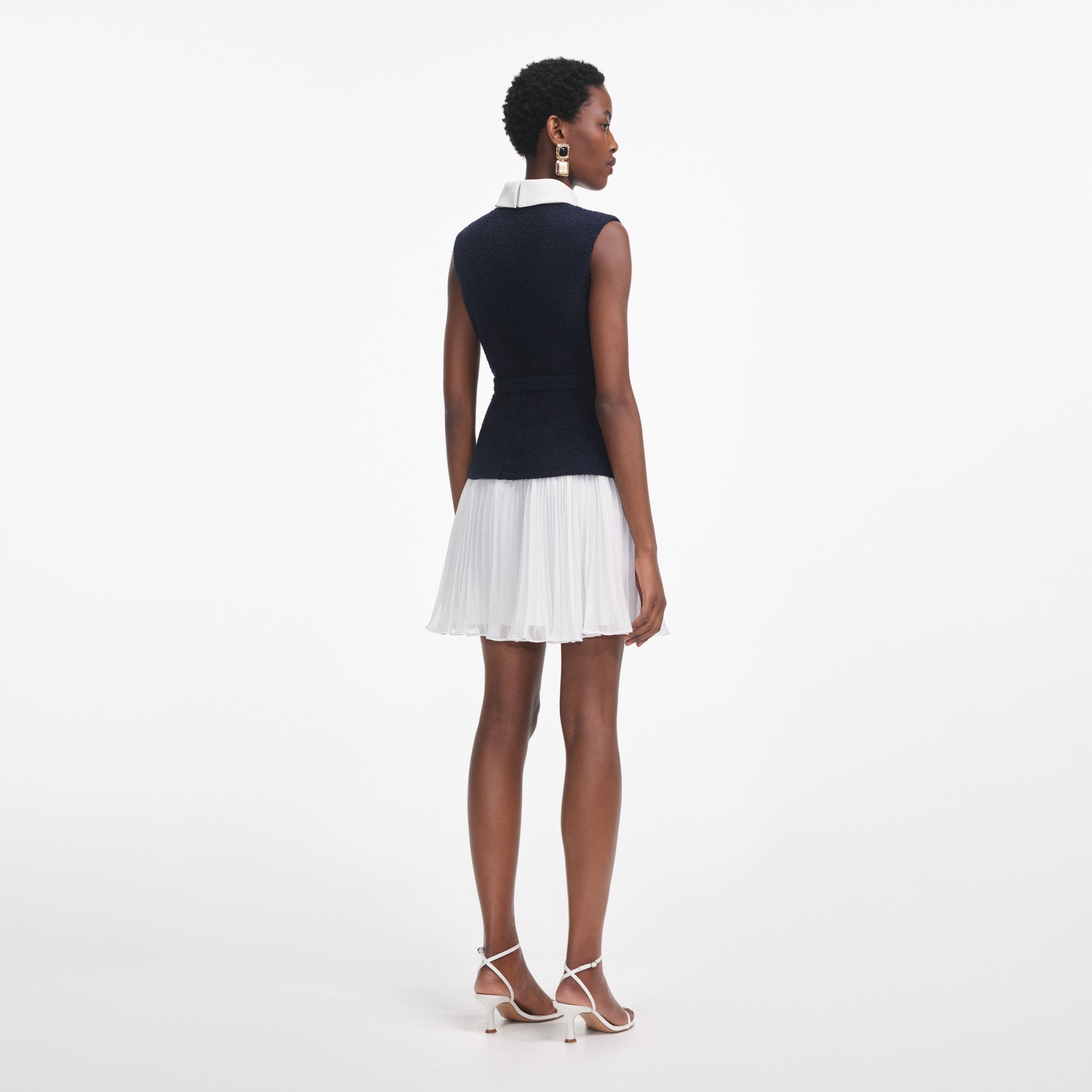 Back view of a woman wearing the Navy Boucle And Chiffon Mini Dress