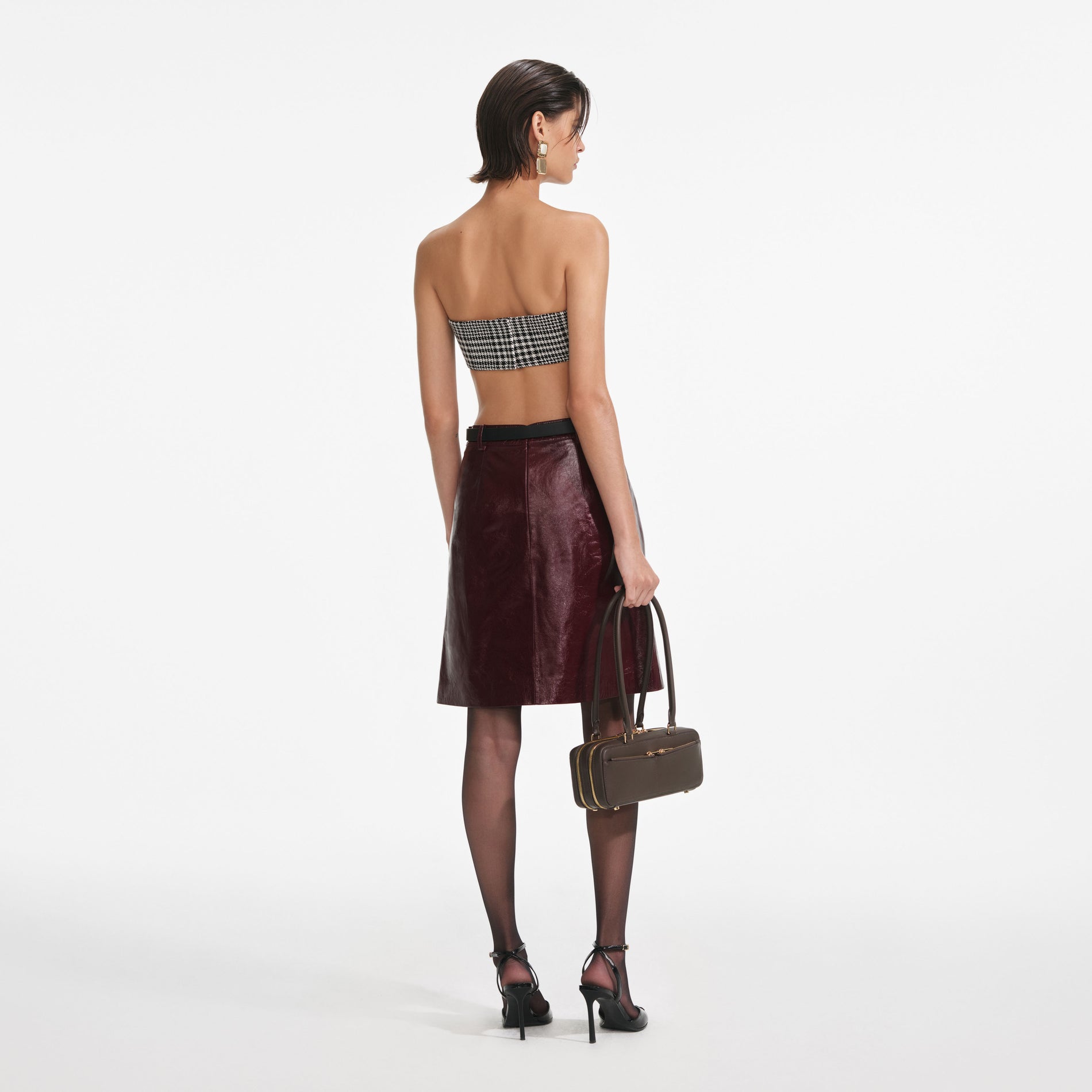 Back view of a woman wearing the Houndstooth Bandeau Top