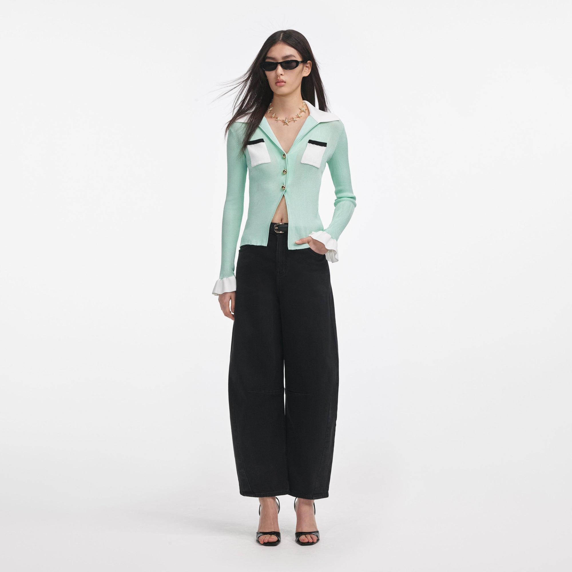 Front view of a woman wearing the Green Ribbed Viscose Knit Top