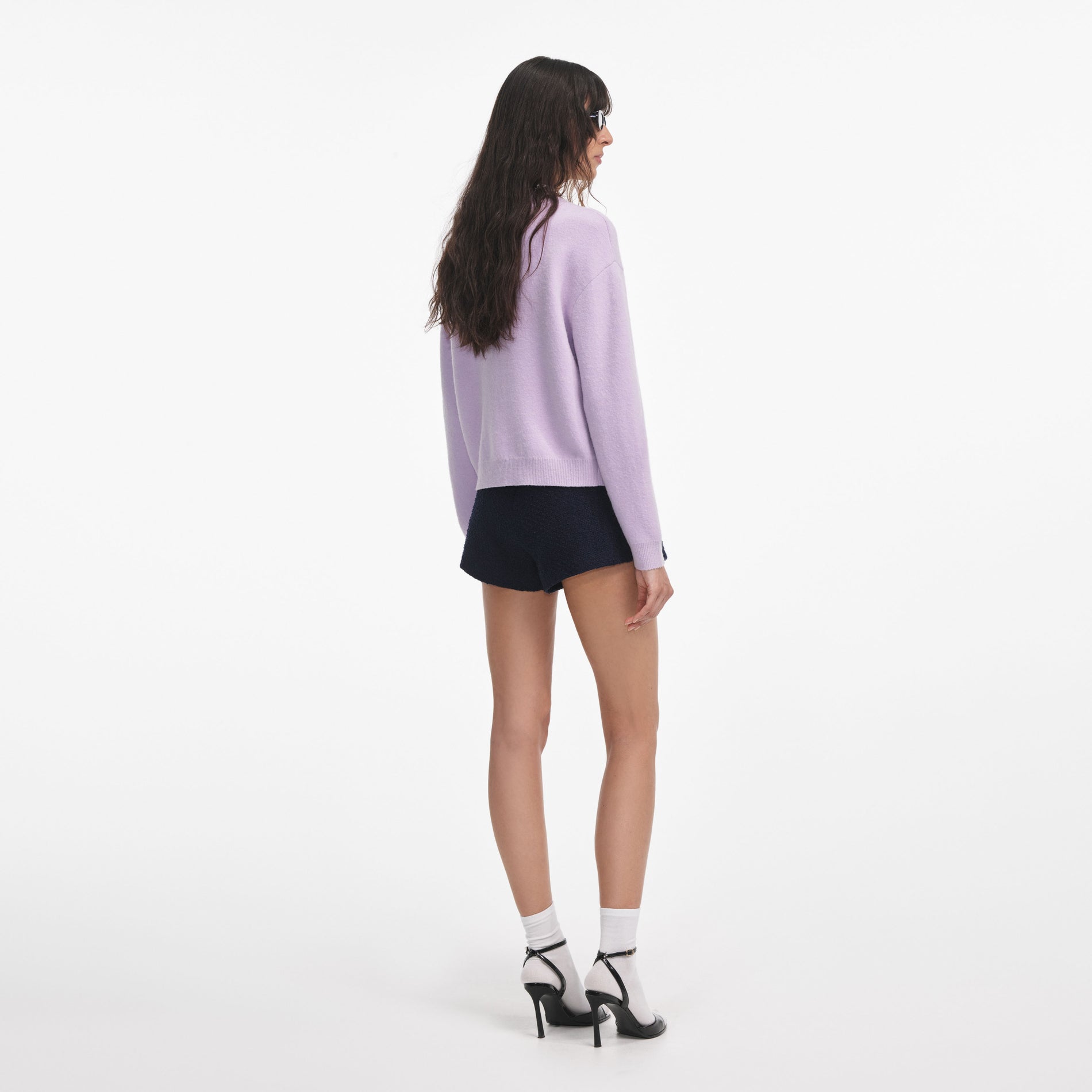 Back view of a woman wearing the Lilac Crystal Trim Cardigan