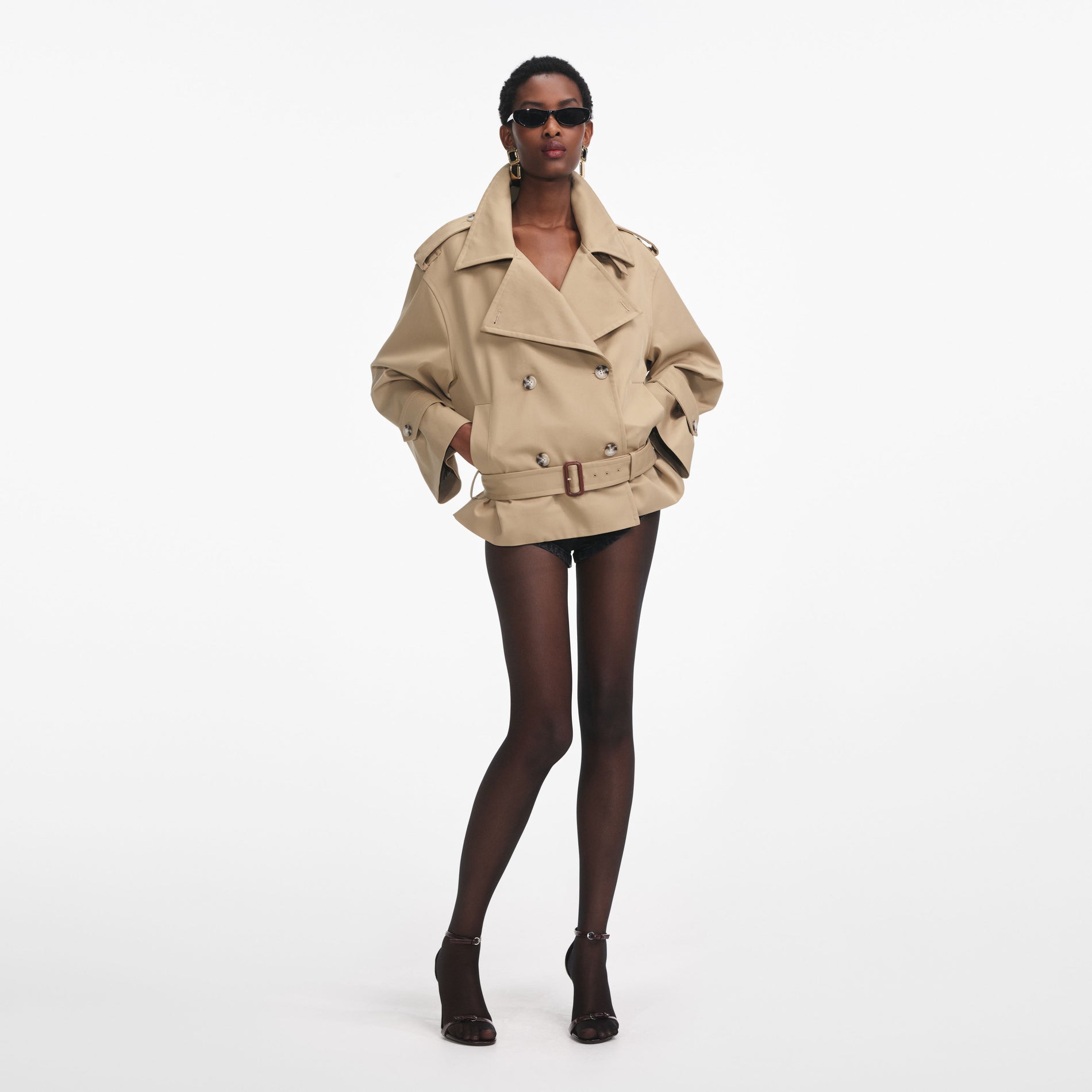 Front view of a woman wearing the Beige Trench Jacket