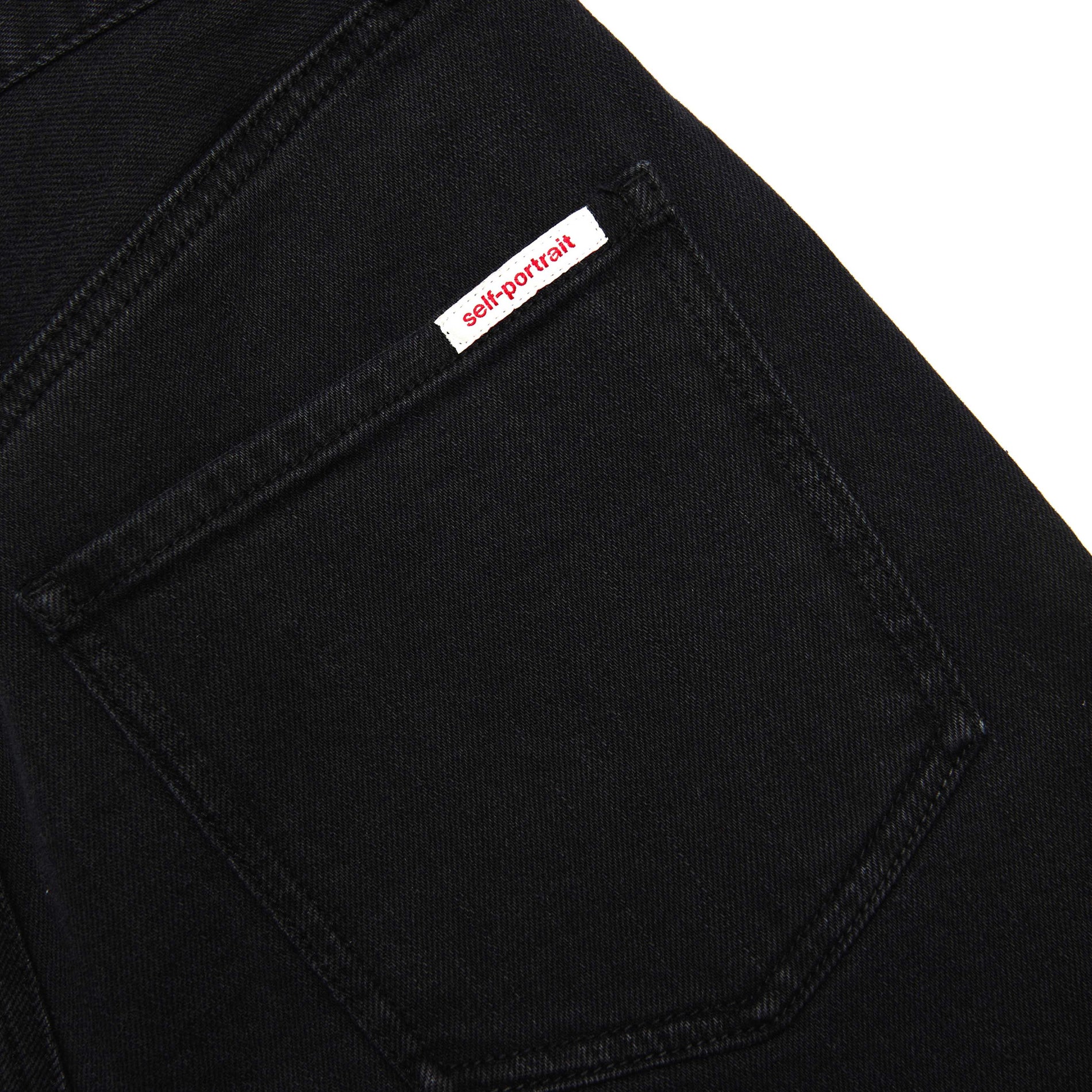 A close up of the fabric for the Black Flared Jeans