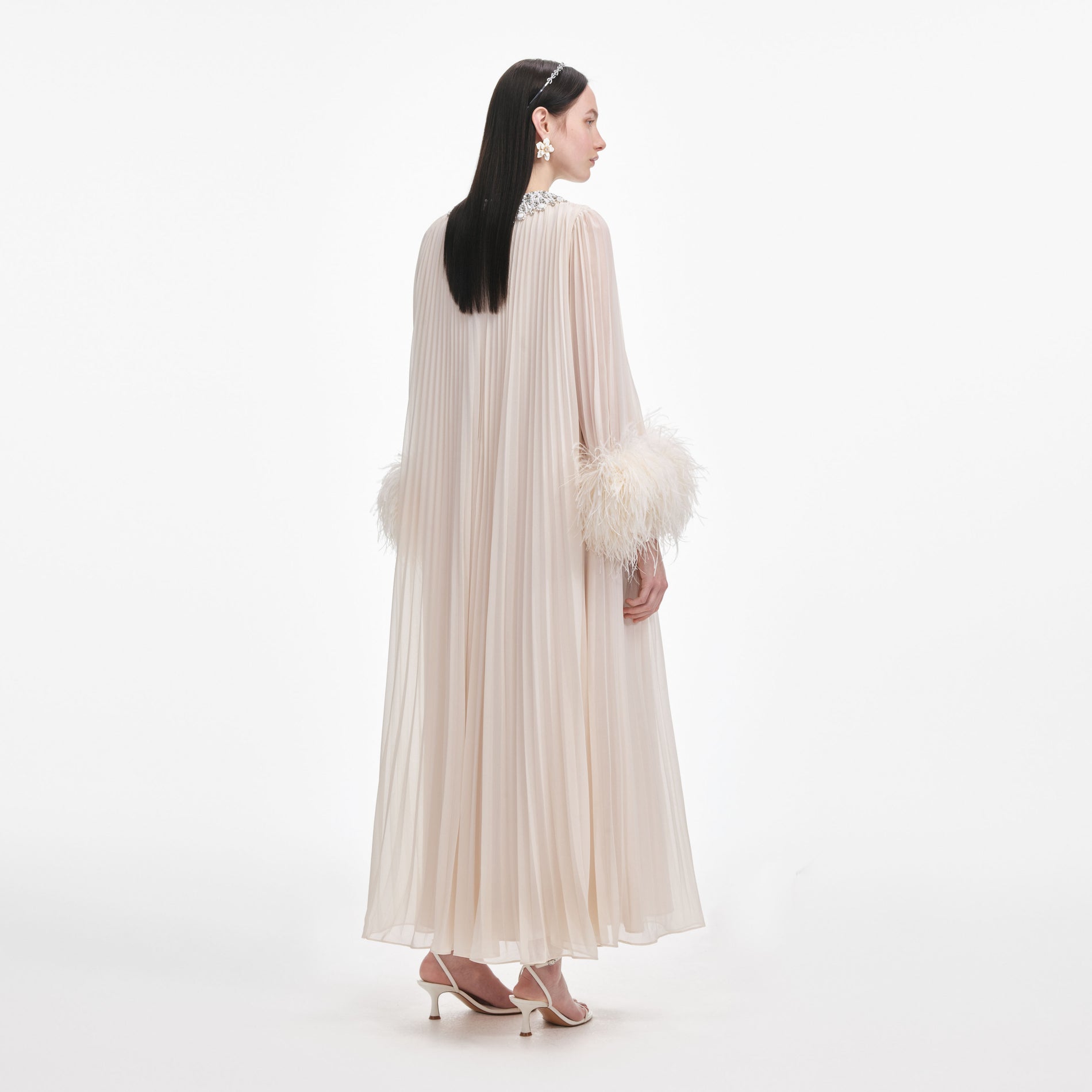 Back view of a woman wearing the Cream Chiffon Feather Midi Dress