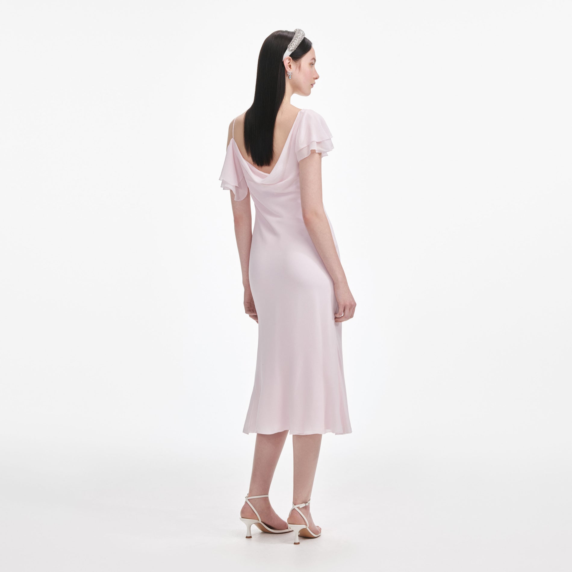 Back view of a woman wearing the Pink Georgette Frill Midi Dress