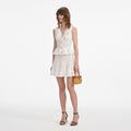 White Pointelle Peplum Knit Mini Dress