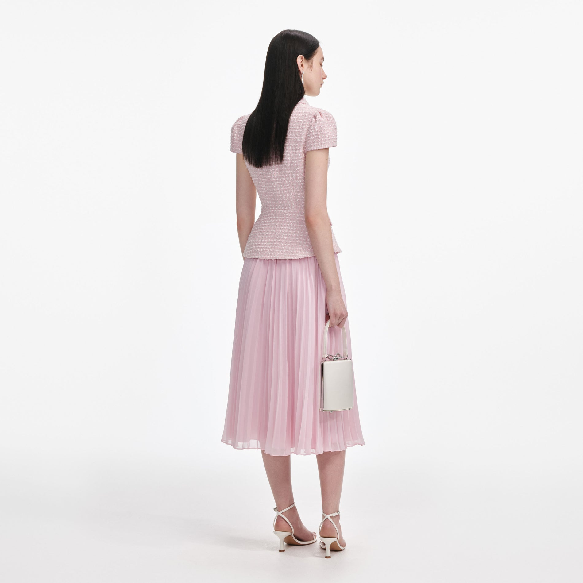 Back view of a woman wearing the Pink Boucle Midi Dress