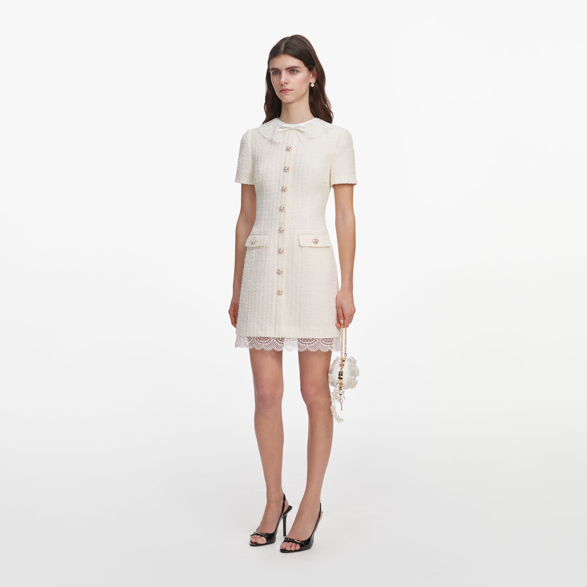 Side view of a woman wearing the Cream Boucle Lace Trim Mini Dress