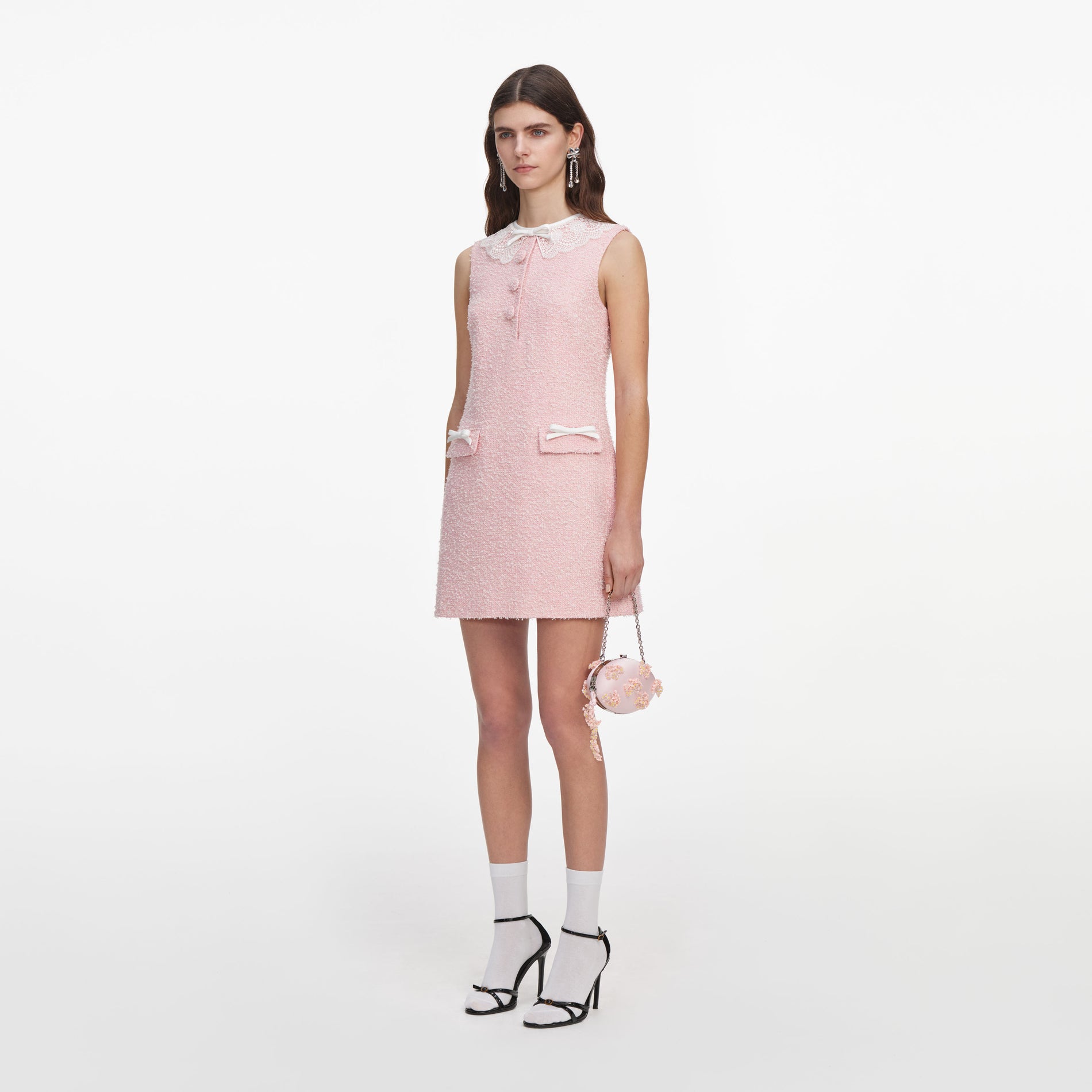 Side view of a woman wearing the Pink Boucle Lace Collar Mini Dress