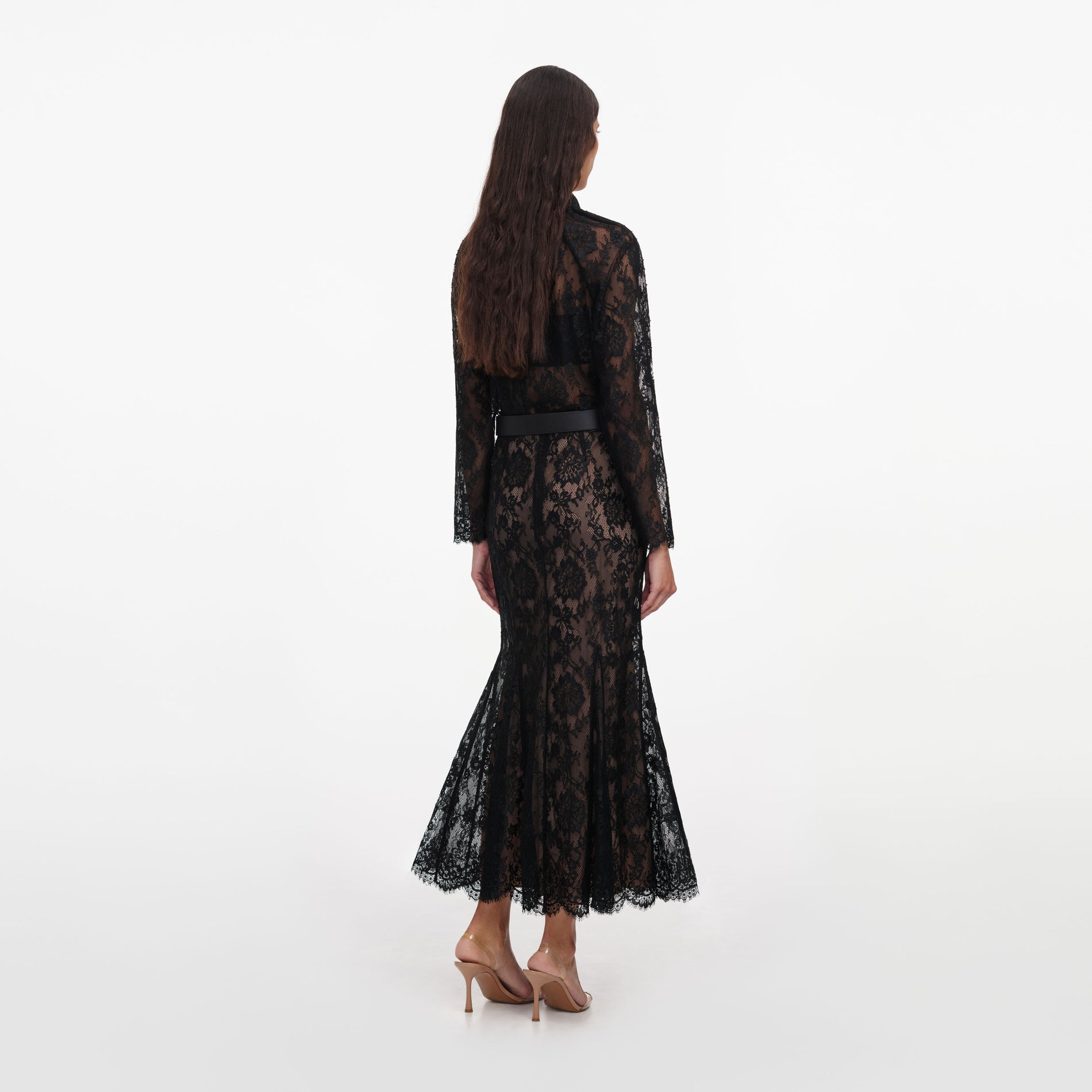 Back view of a woman wearing the Black Lace Midi Skirt