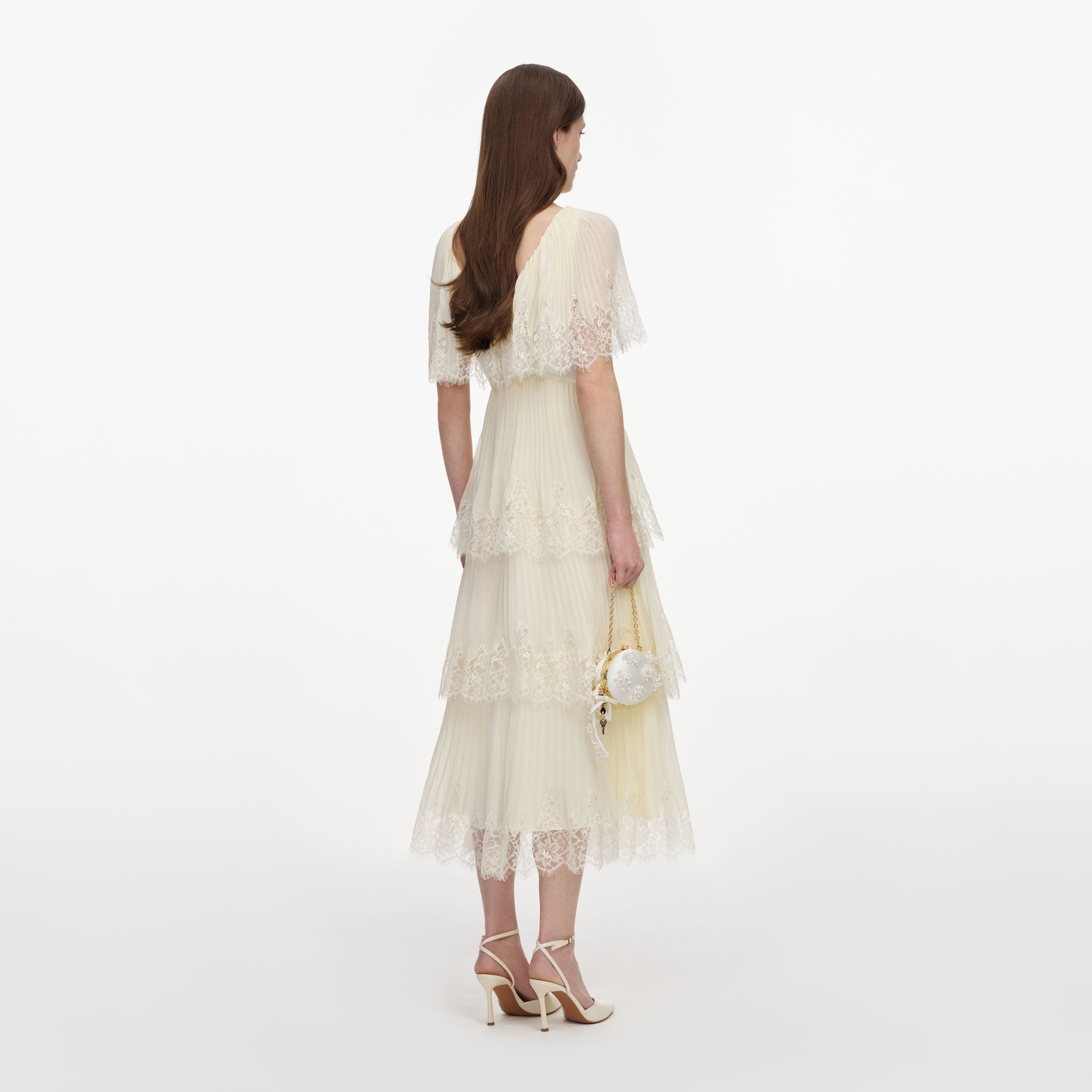 Back view of a woman wearing the Yellow Chiffon Tiered Midi Dress