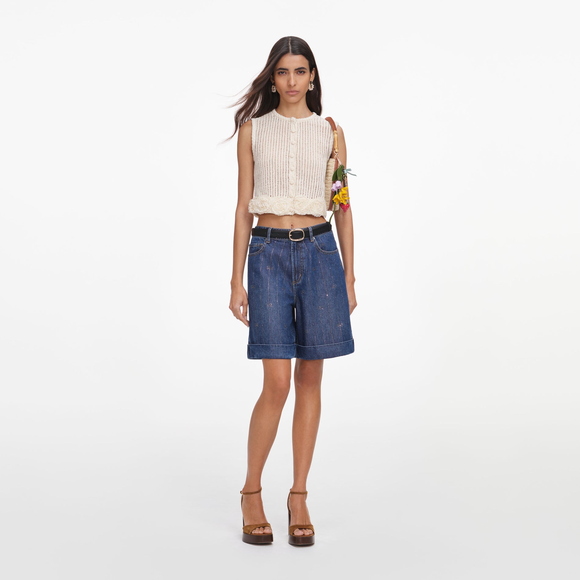 Front view of a woman wearing the Cream Crochet Flower Knit Top