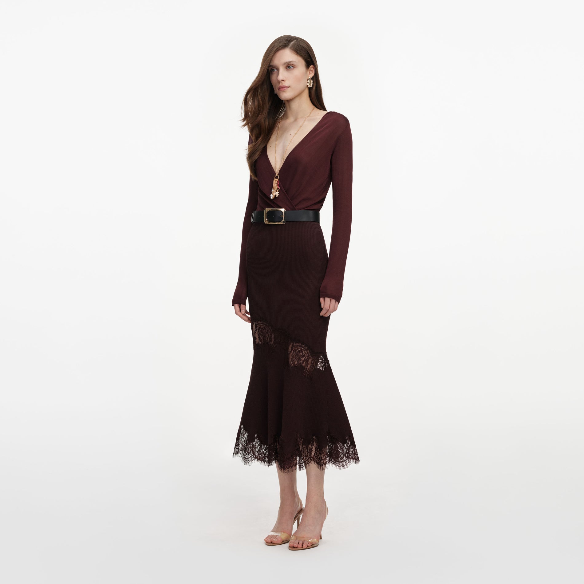 Side view of a woman wearing the Brown Ribbed Knit Midi Skirt