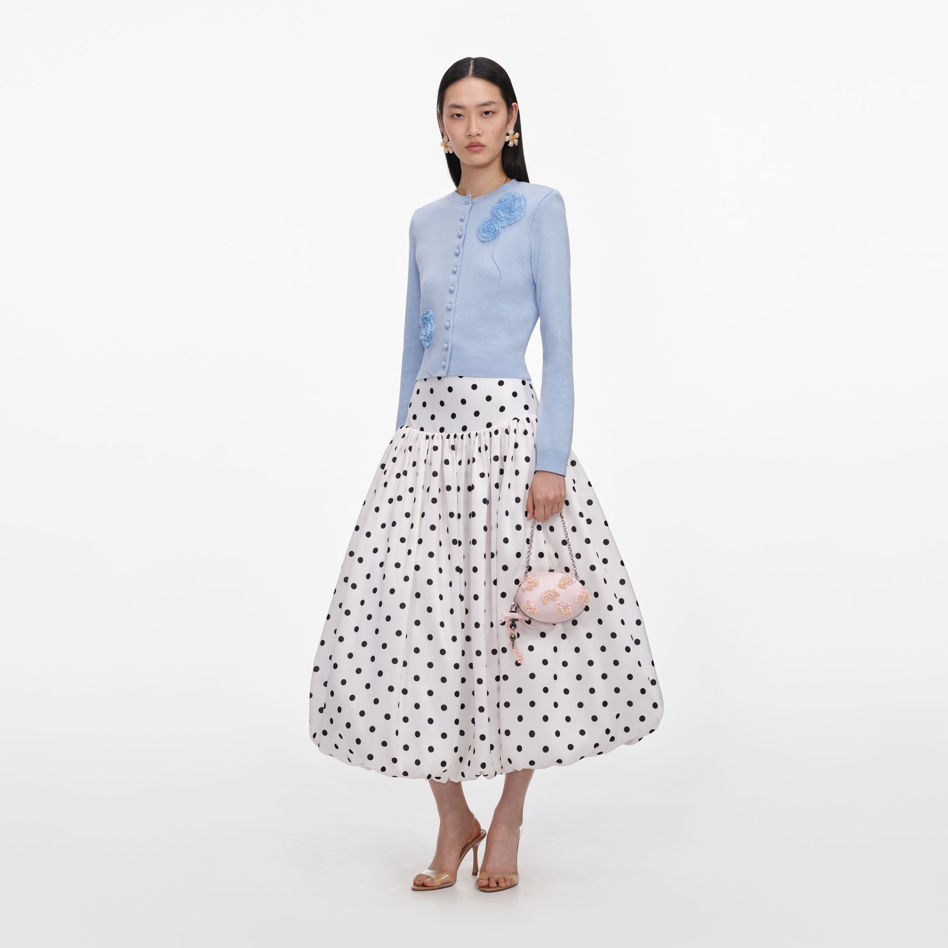 Side view of a woman wearing the Blue Flower Knit Cardigan