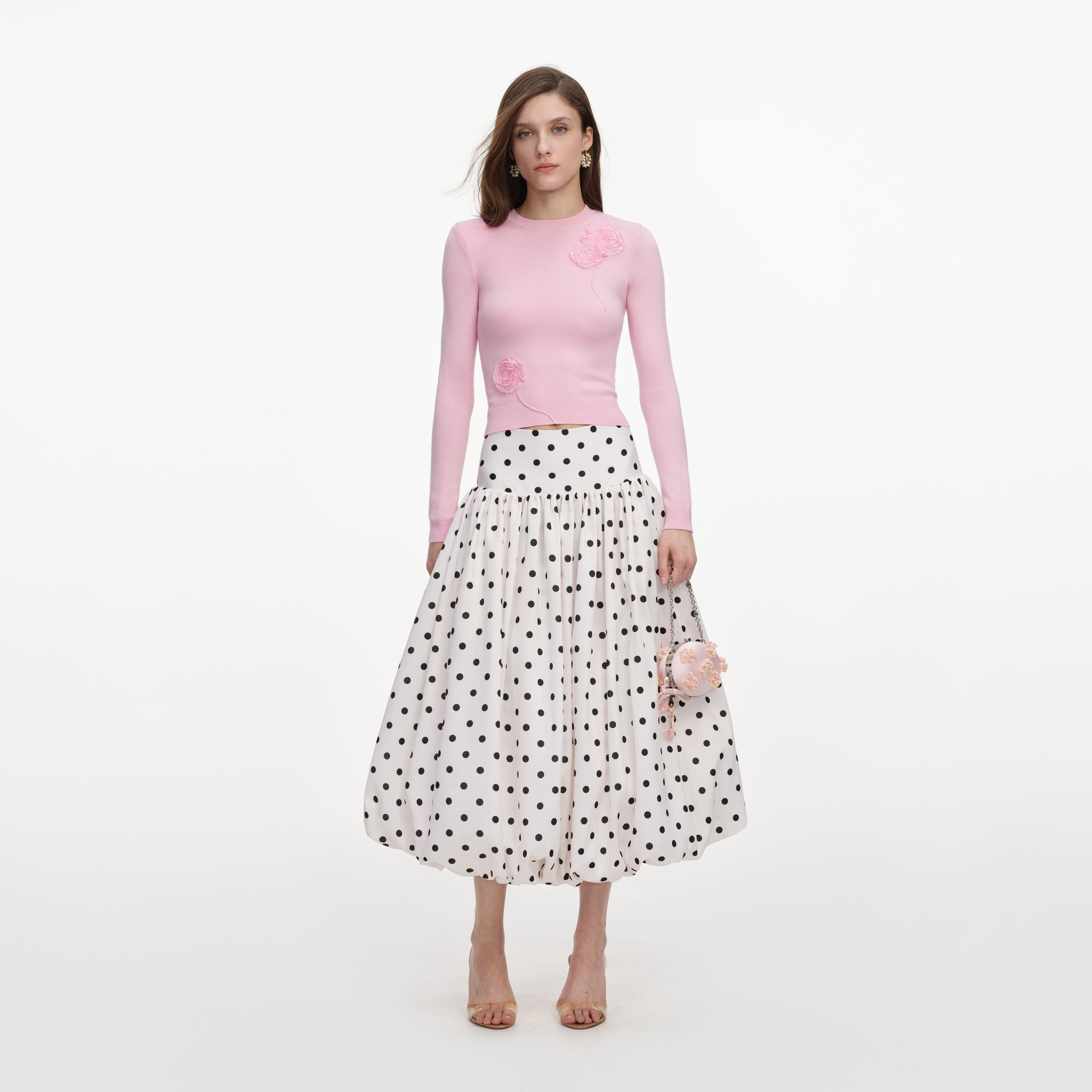 Front view of a woman wearing the Pink Flower Knit Jumper