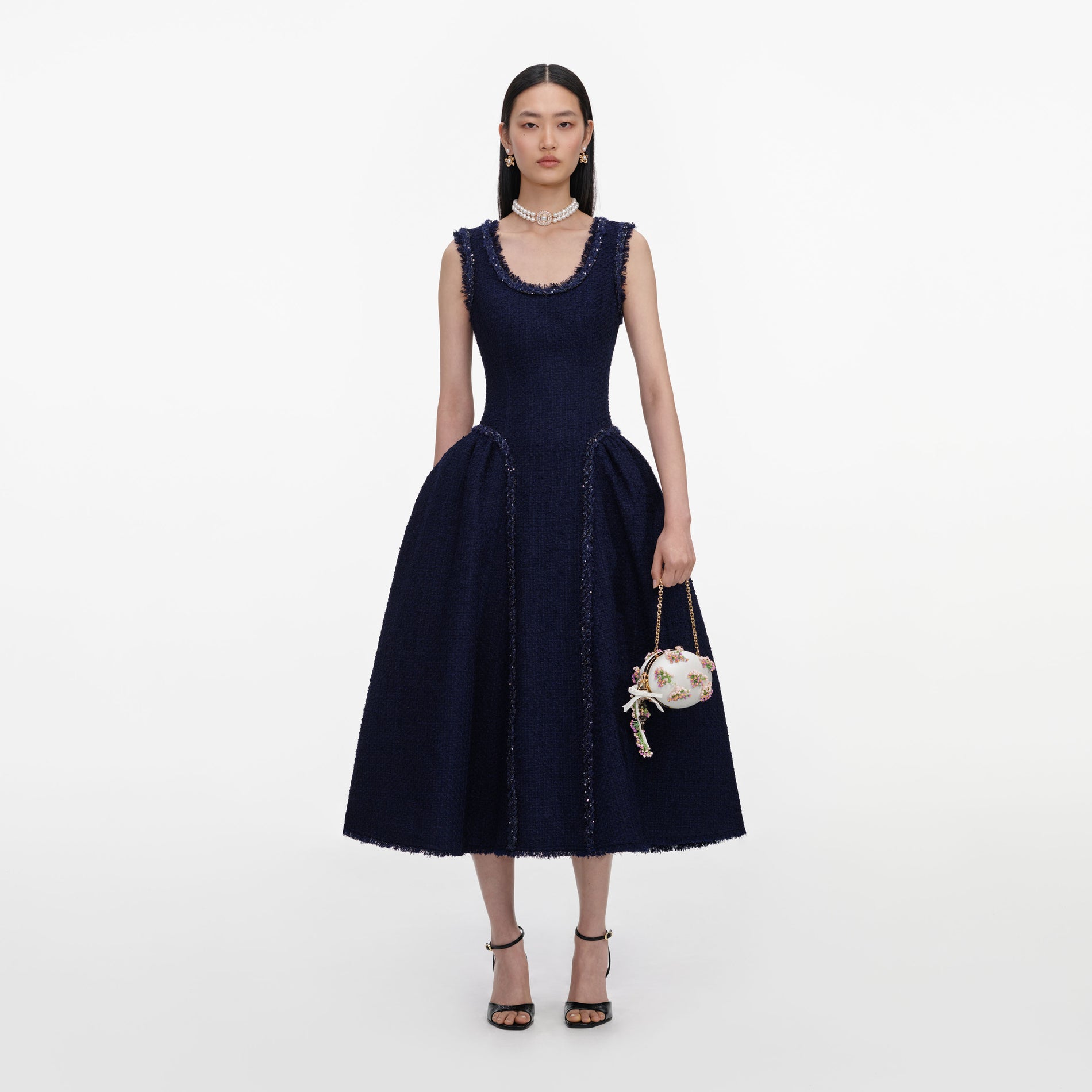 Front view of a woman wearing the Navy Boucle Midi Dress