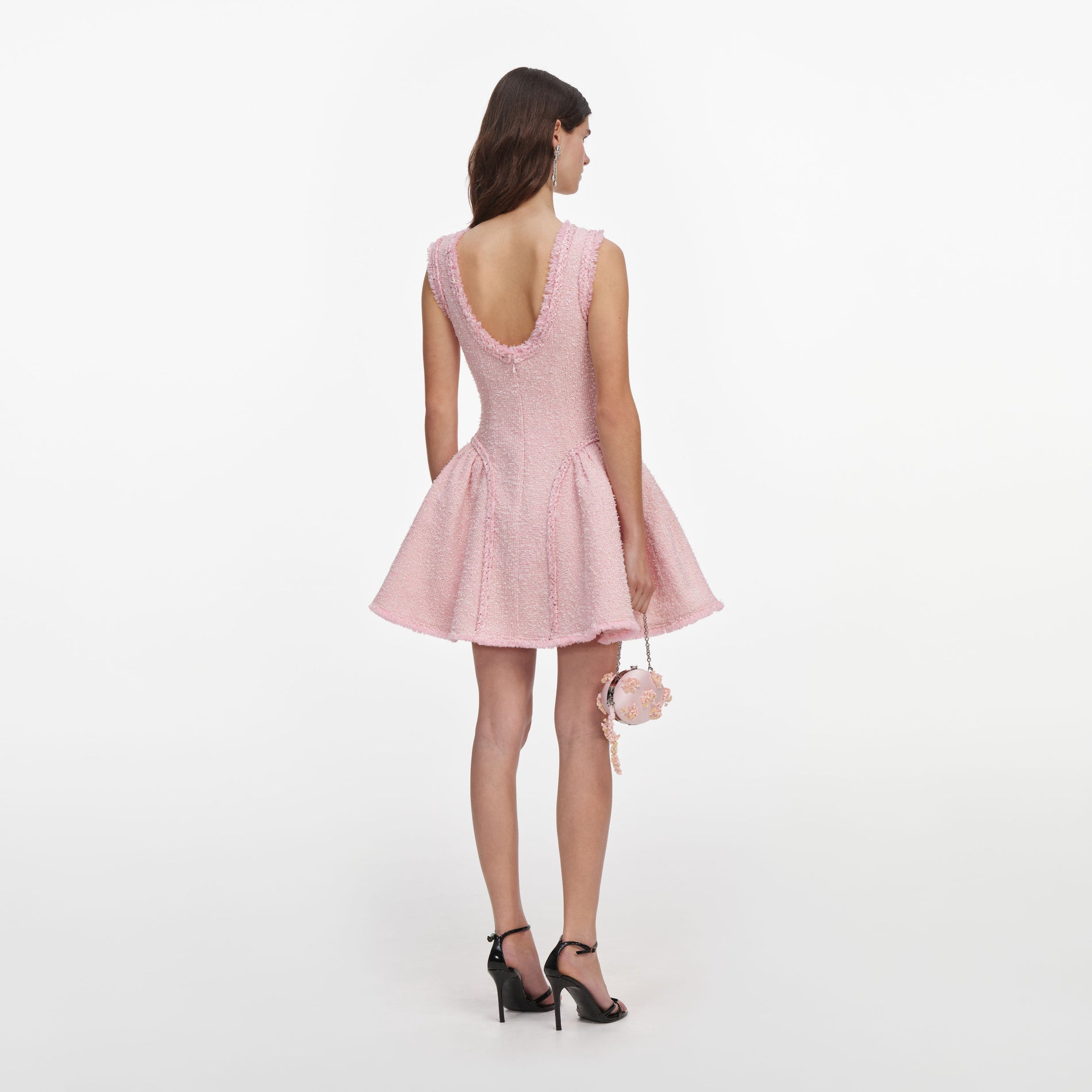 Back view of a woman wearing the Pink Boucle Sleeveless Mini Dress