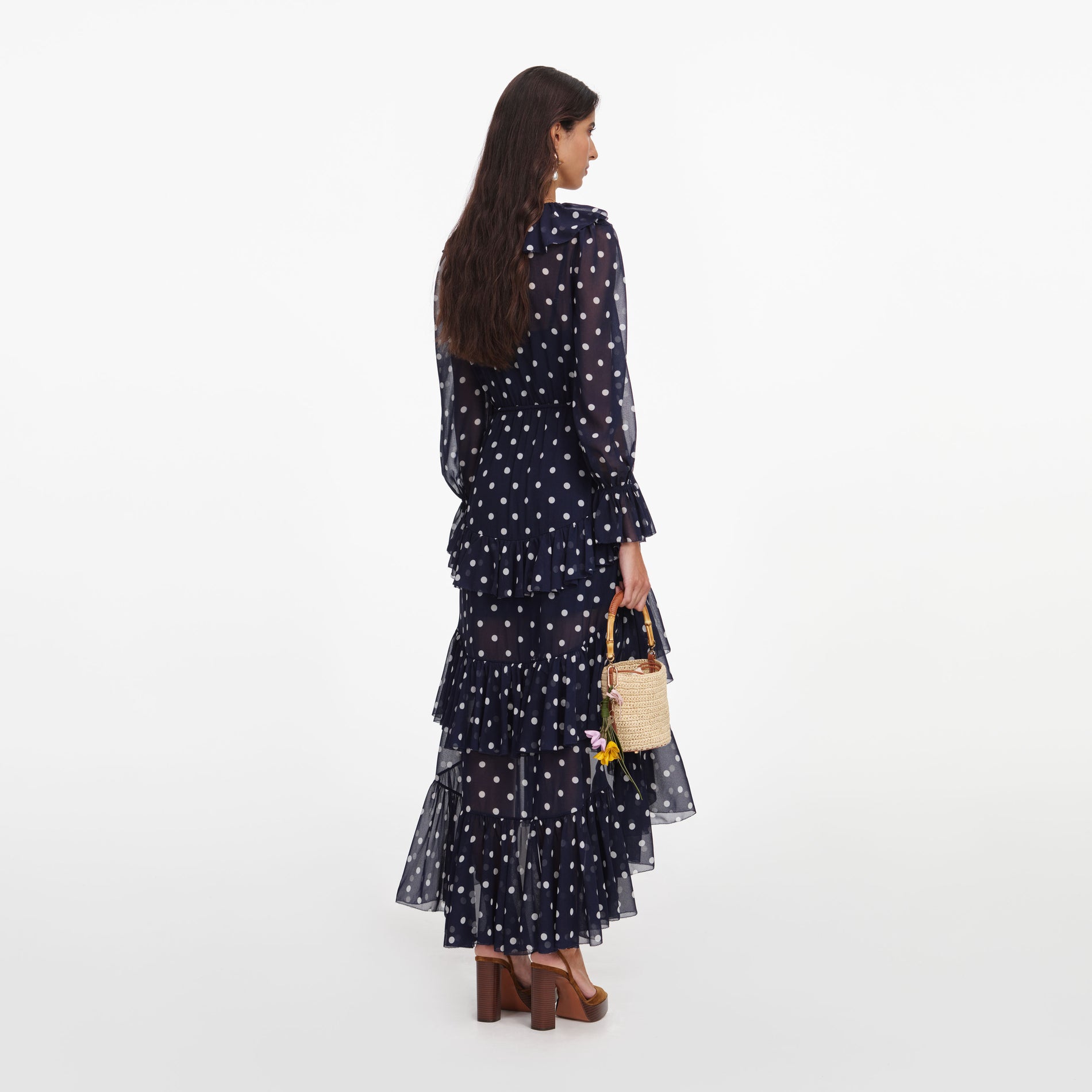Back view of a woman wearing the Polka Dot Georgette Ruffle Maxi Dress