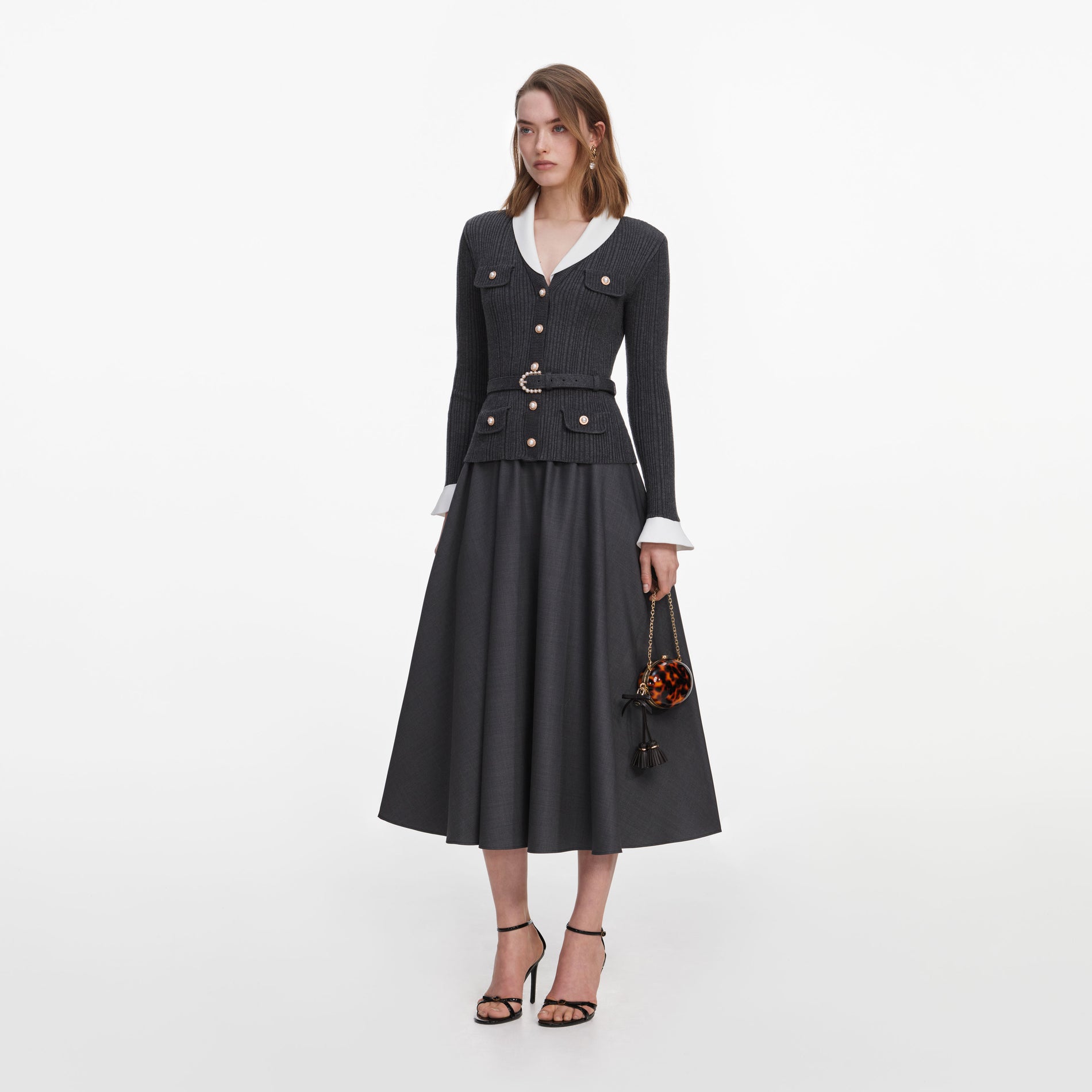 Side view of a woman wearing the Grey Knit Twill Midi Dress