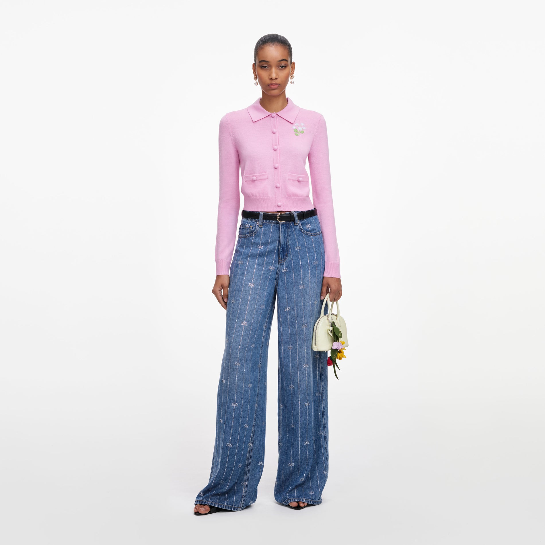 Front view of a woman wearing the Pink Flower Embroidered Knit Cardigan