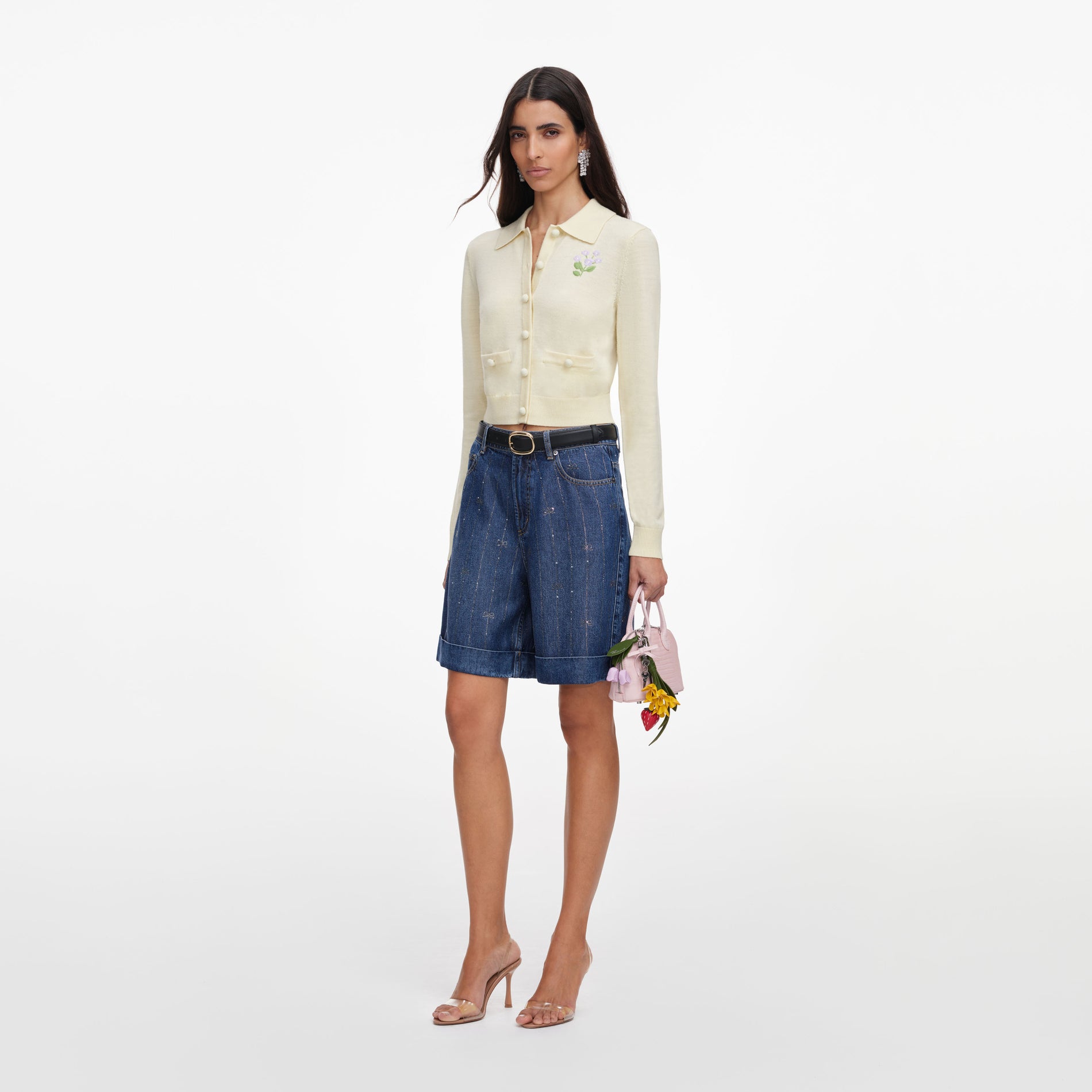 Side view of a woman wearing the Yellow Flower Embroidered Knit Cardigan