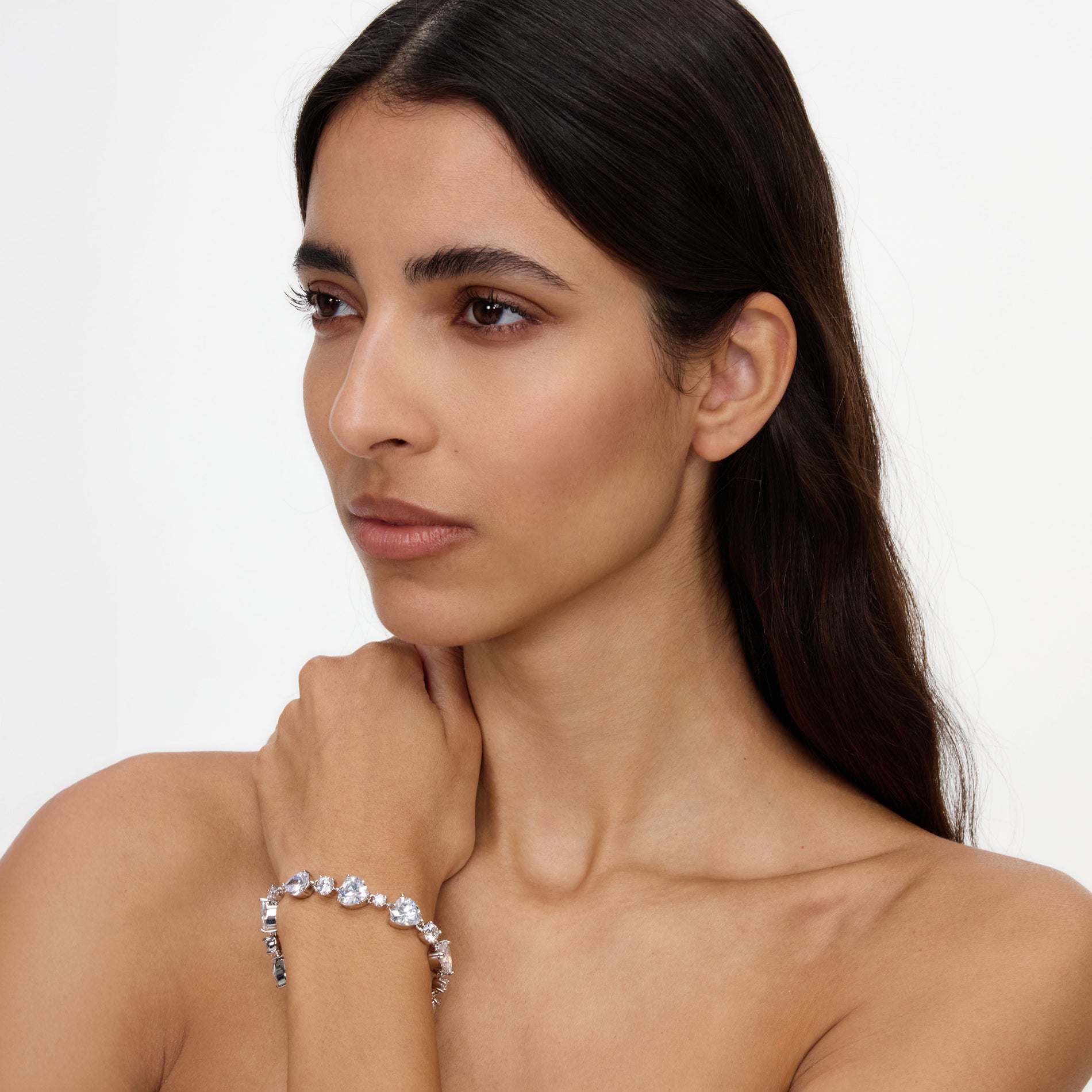 A close up of a woman wearing the Crystal Droplet Bracelet