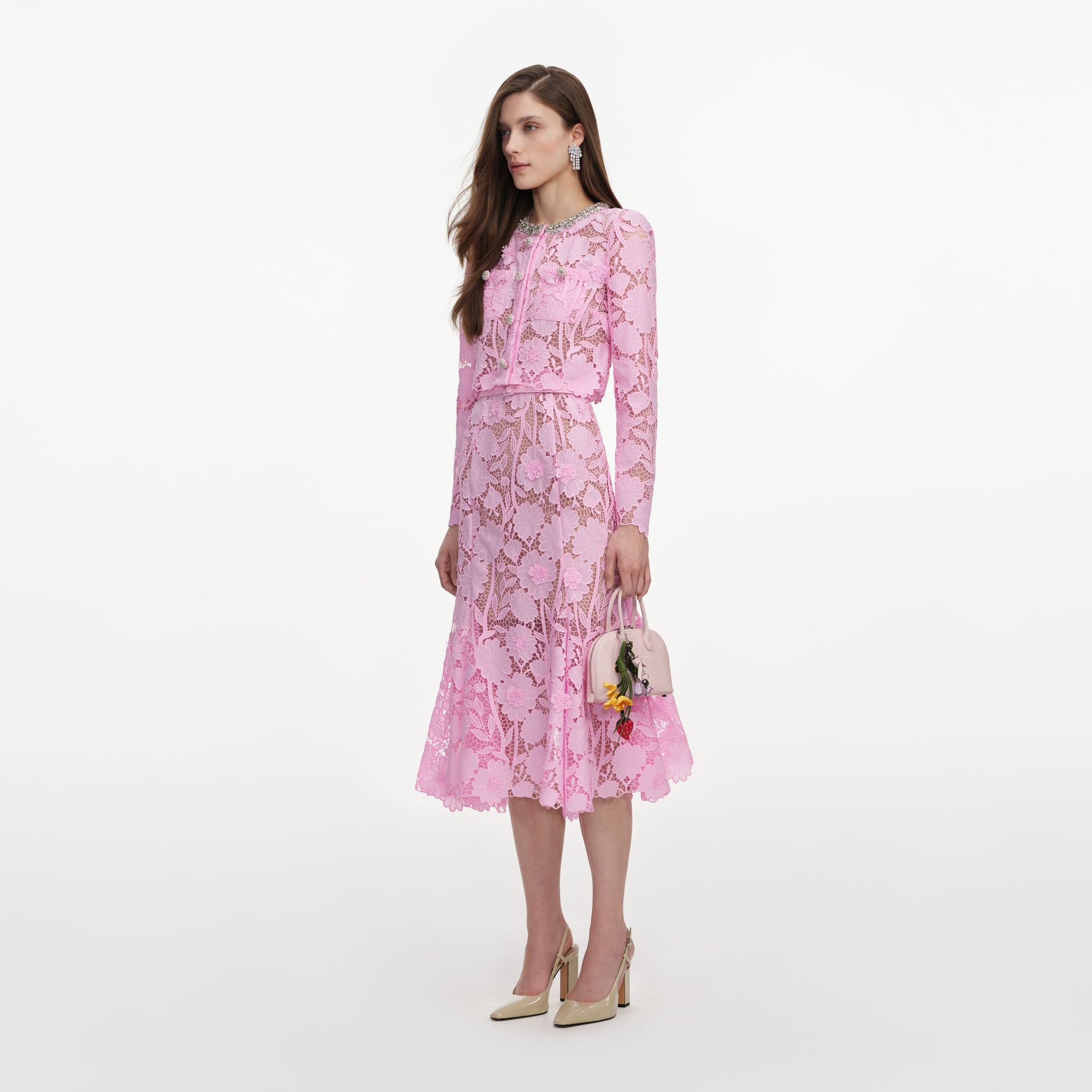 Side view of a woman wearing the Pink Lace Crystal Embellished Midi Dress