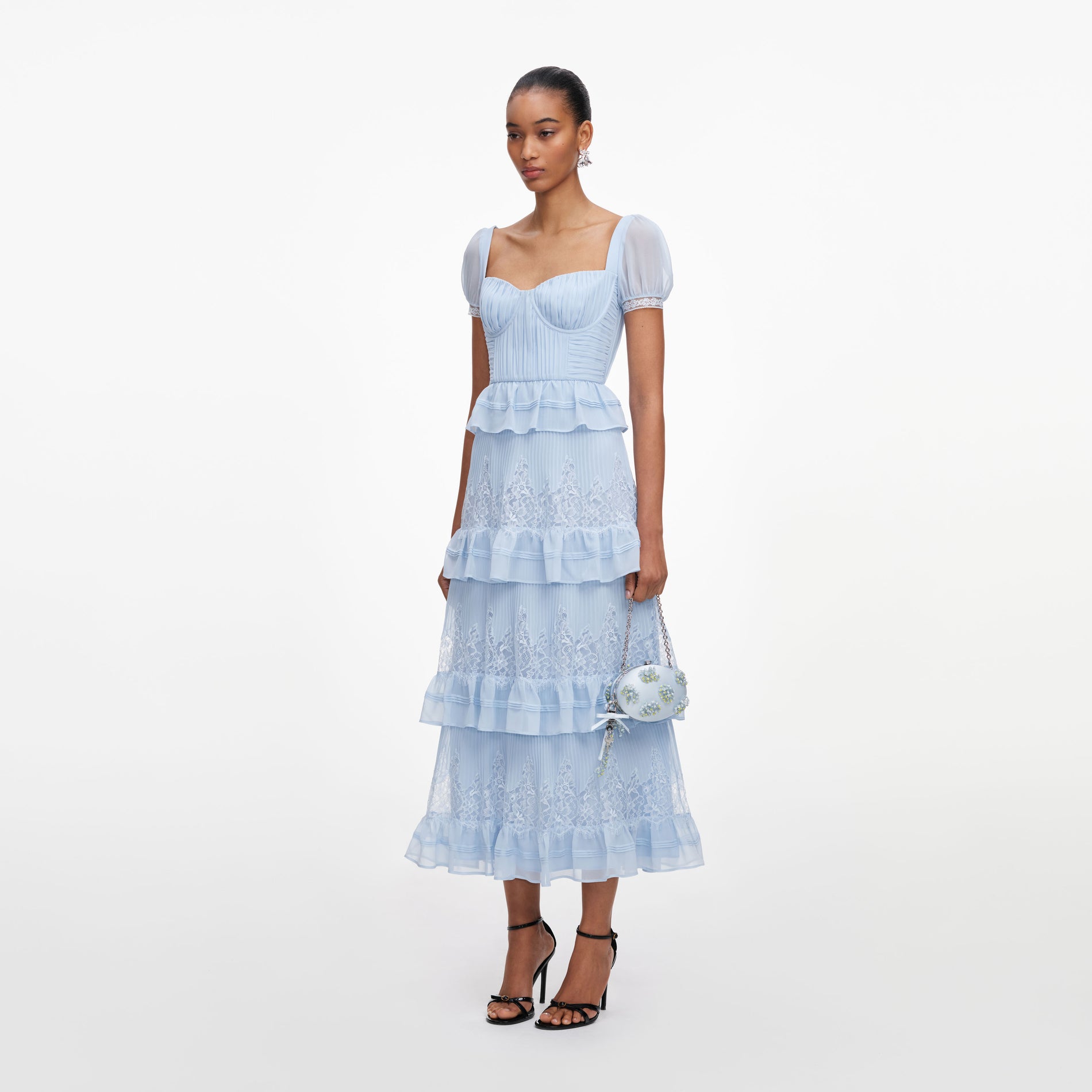 Side view of a woman wearing the Blue Chiffon Short Sleeve Midi Dress