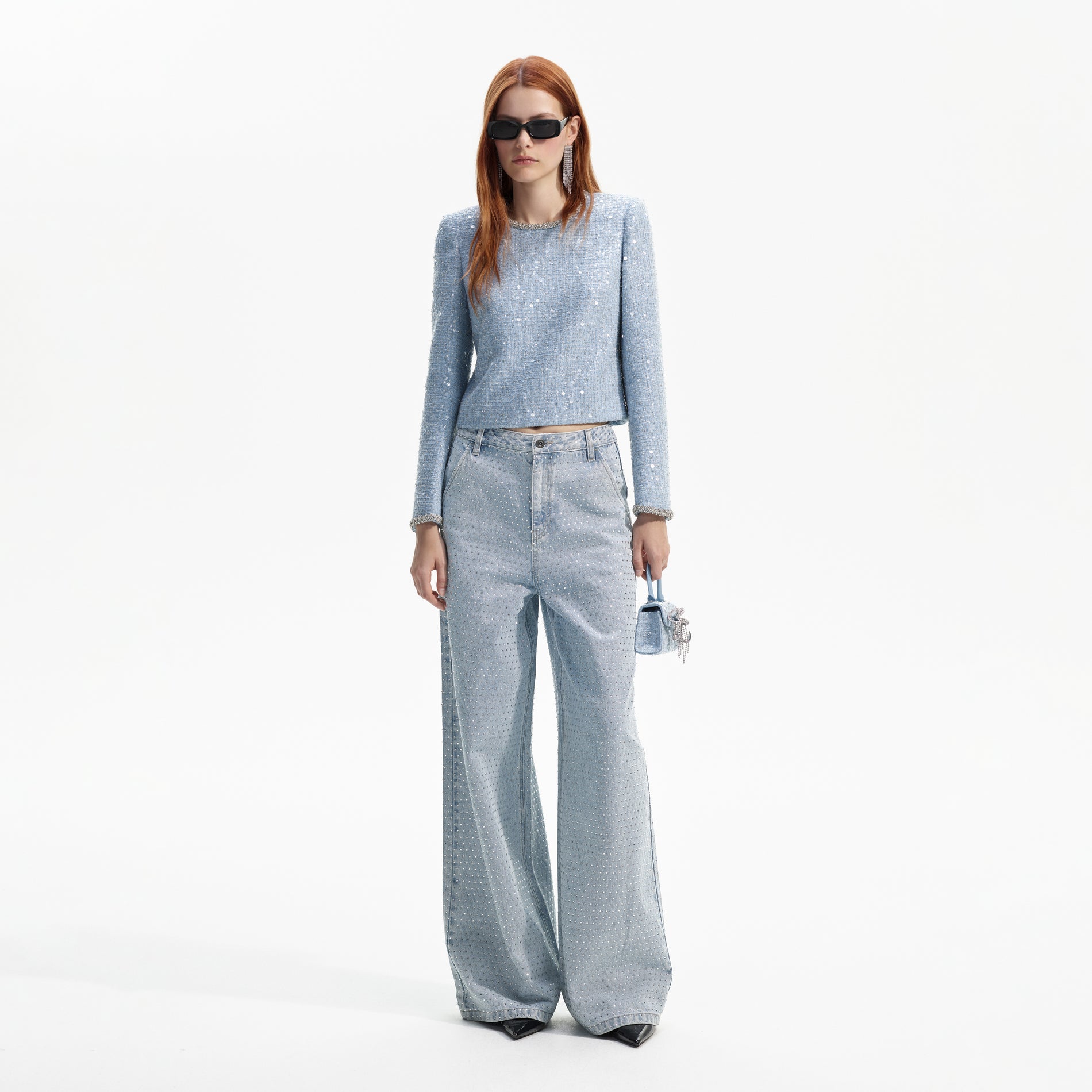 Front view of a woman wearing the Blue Sequin Boucle Top