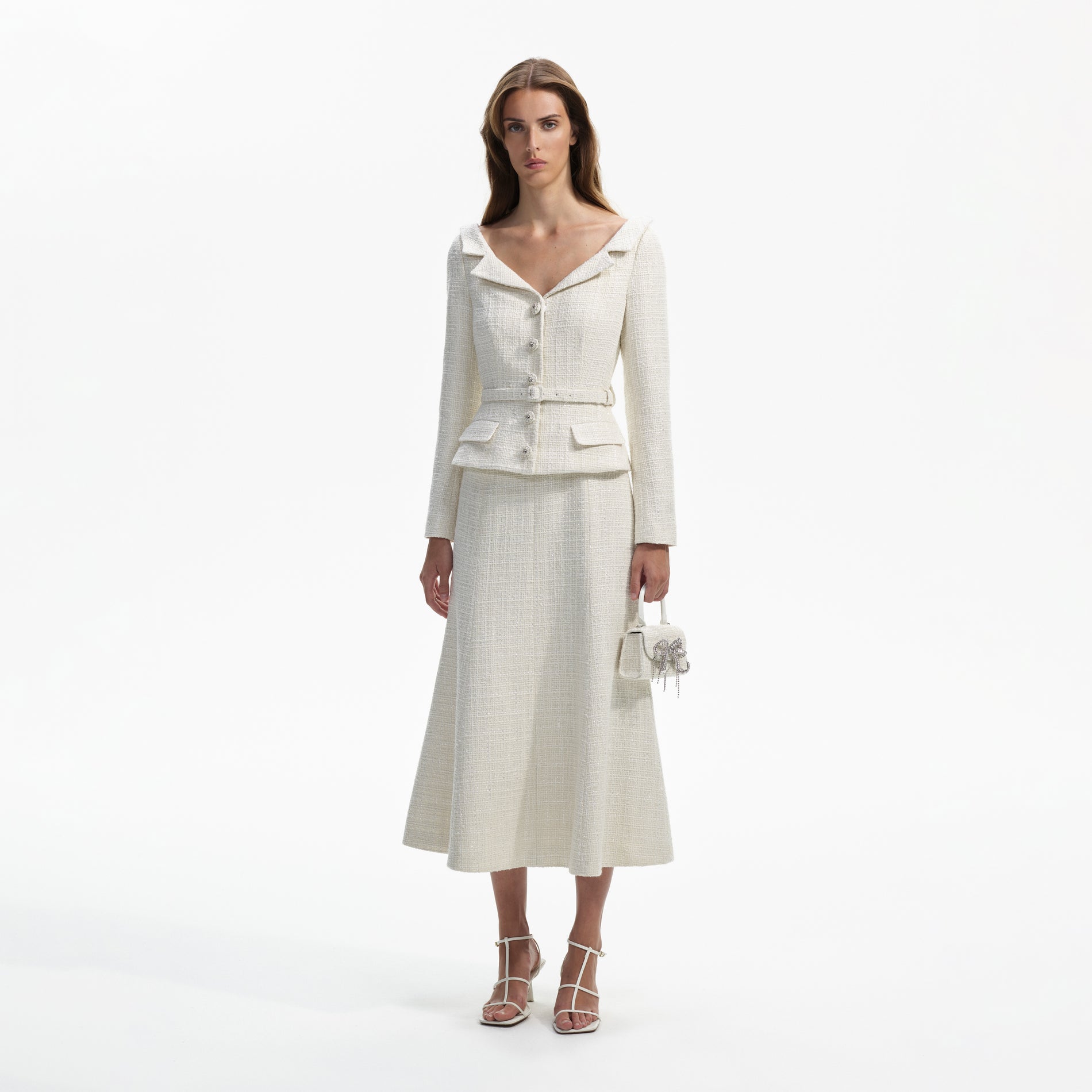 Side view of a woman wearing the Cream Boucle Tailored Off Shoulder Midi Dress